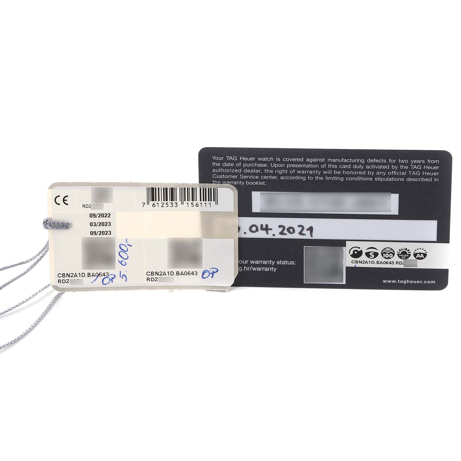 The image shows warranty and serial number cards for the Tag Heuer Limited Edition CBN2A1D.BA0643 Men's Stainless Steel Silver Dial CBN2A1D.BA0643 Men's Stainless Steel Silver Dial model CBN2A1D.BA0643.