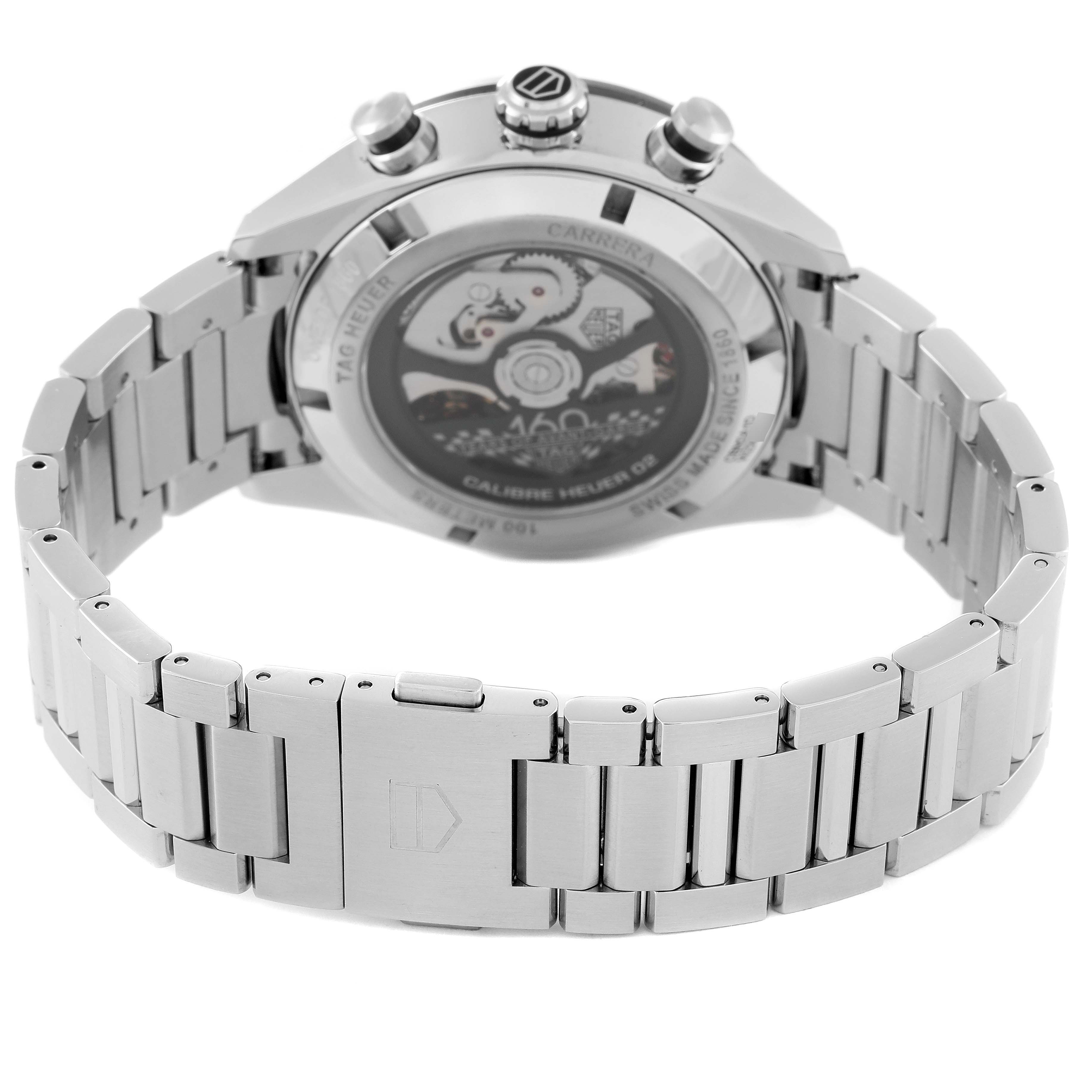 The image shows the back view of the Tag Heuer Carrera Limited Edition watch, highlighting its stainless steel bracelet and transparent case back.