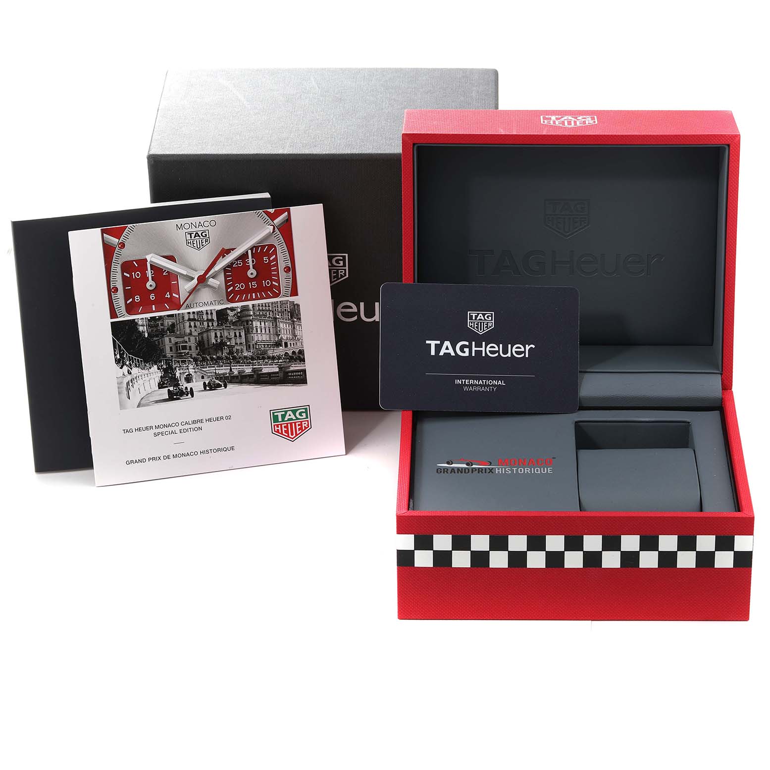 The image shows the packaging, warranty card, and promotional booklet for the Tag Heuer Monaco CBL2114.FC6486 Men's Stainless Steel Red Dial CBL2114.FC6486 Men's Stainless Steel Red Dial watch model.