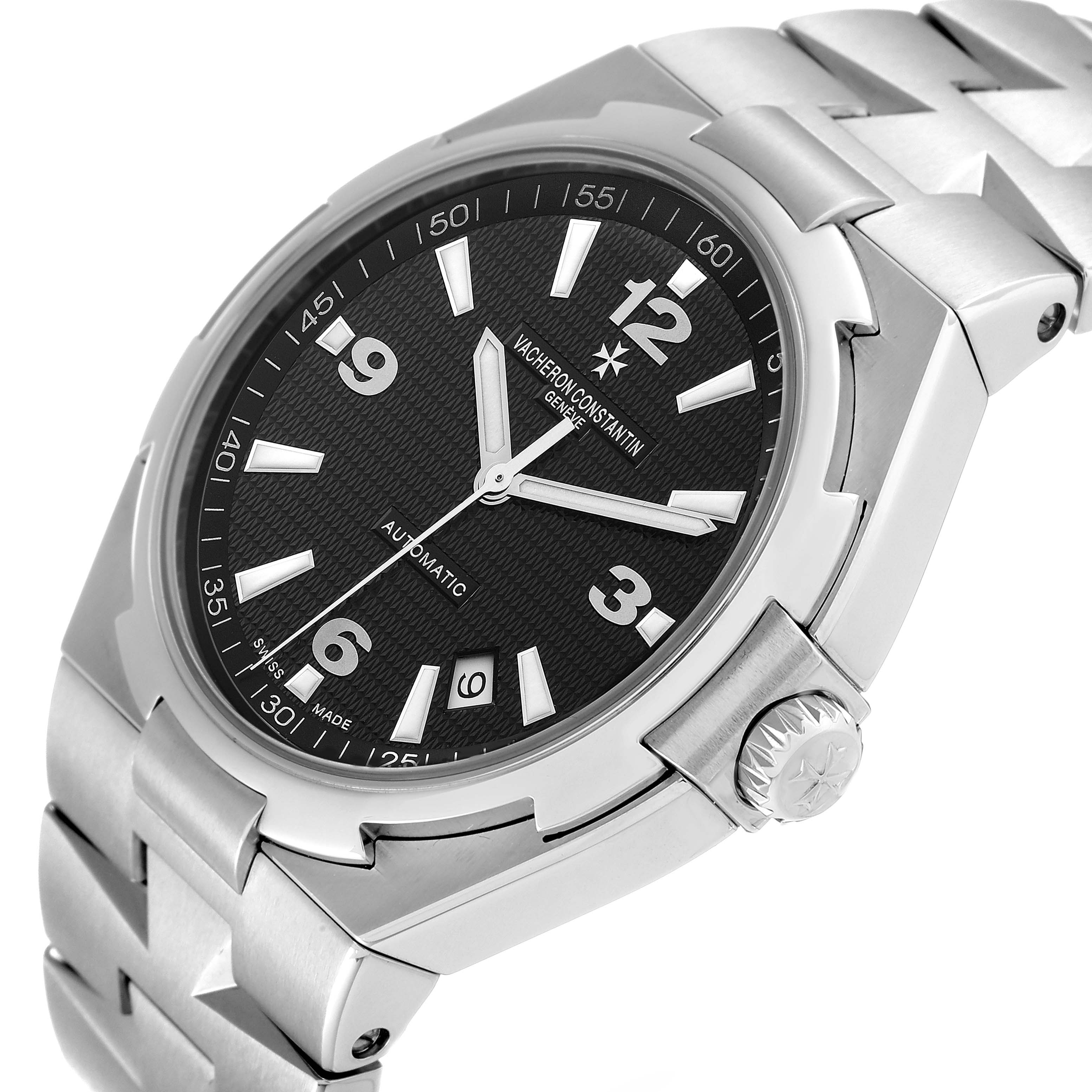 The image shows a Vacheron Constantin Overseas 47040/B01A-9094 Men's Stainless Steel Black Dial 47040/B01A-9094 Men's Stainless Steel Black Dial model from a front angle, highlighting its black dial, silver bracelet, and crown.