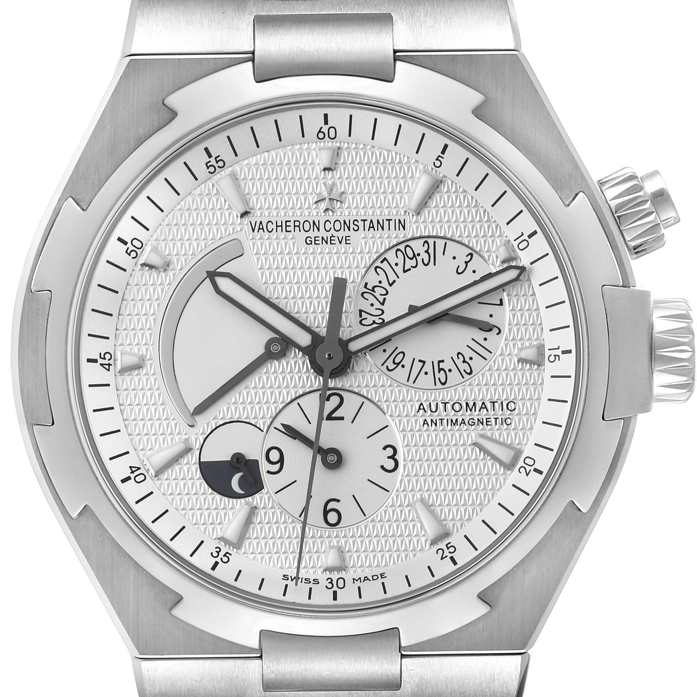 The image displays the face of the Vacheron Constantin Overseas 47450/B01A-9226 Men
s Stainless Steel Silver Dial 47450/B01A-9226 Men
s Stainless Steel Silver Dial model, showcasing its dial, hands, subdials, and crown at a straight-on angle.