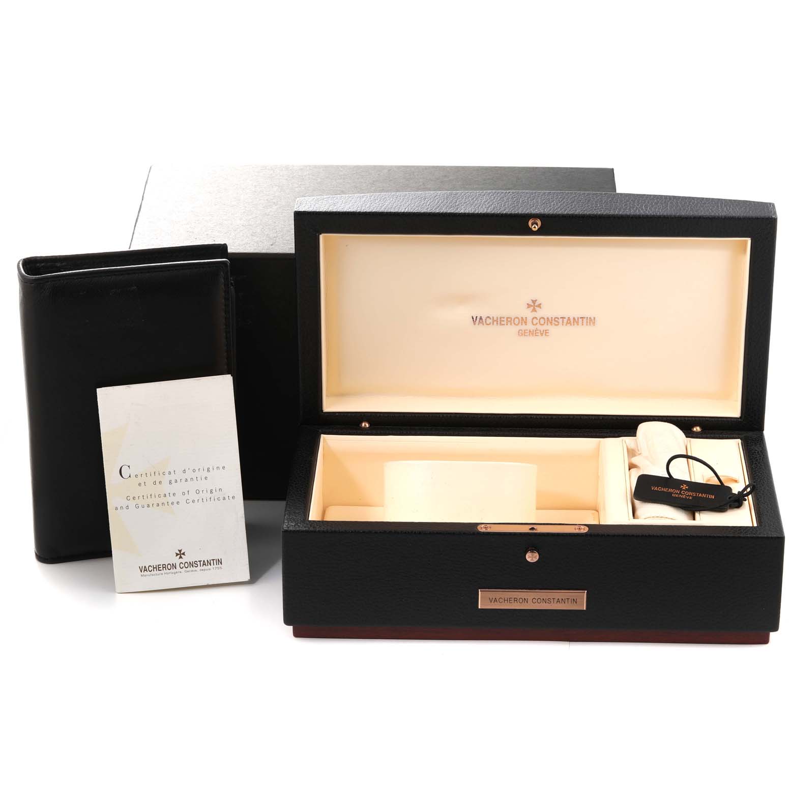 The image shows the opened box of the Overseas model by Vacheron Constantin, along with a certificate and additional accessories.