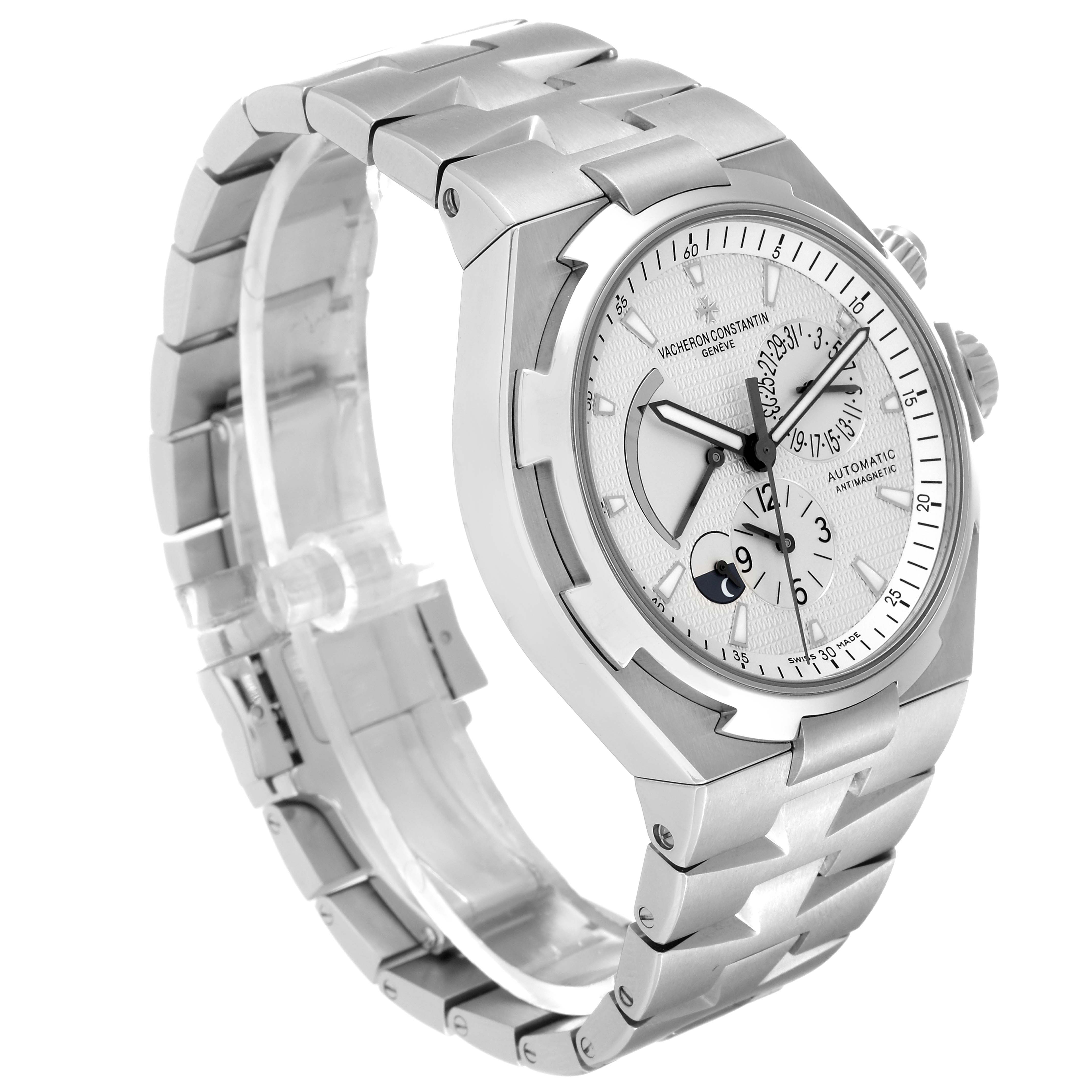 The image shows a side angle of a Vacheron Constantin Overseas 47450/B01A-9226 Men
s Stainless Steel Silver Dial 47450/B01A-9226 Men
s Stainless Steel Silver Dial watch, highlighting the face, bezel, bracelet, and crown.