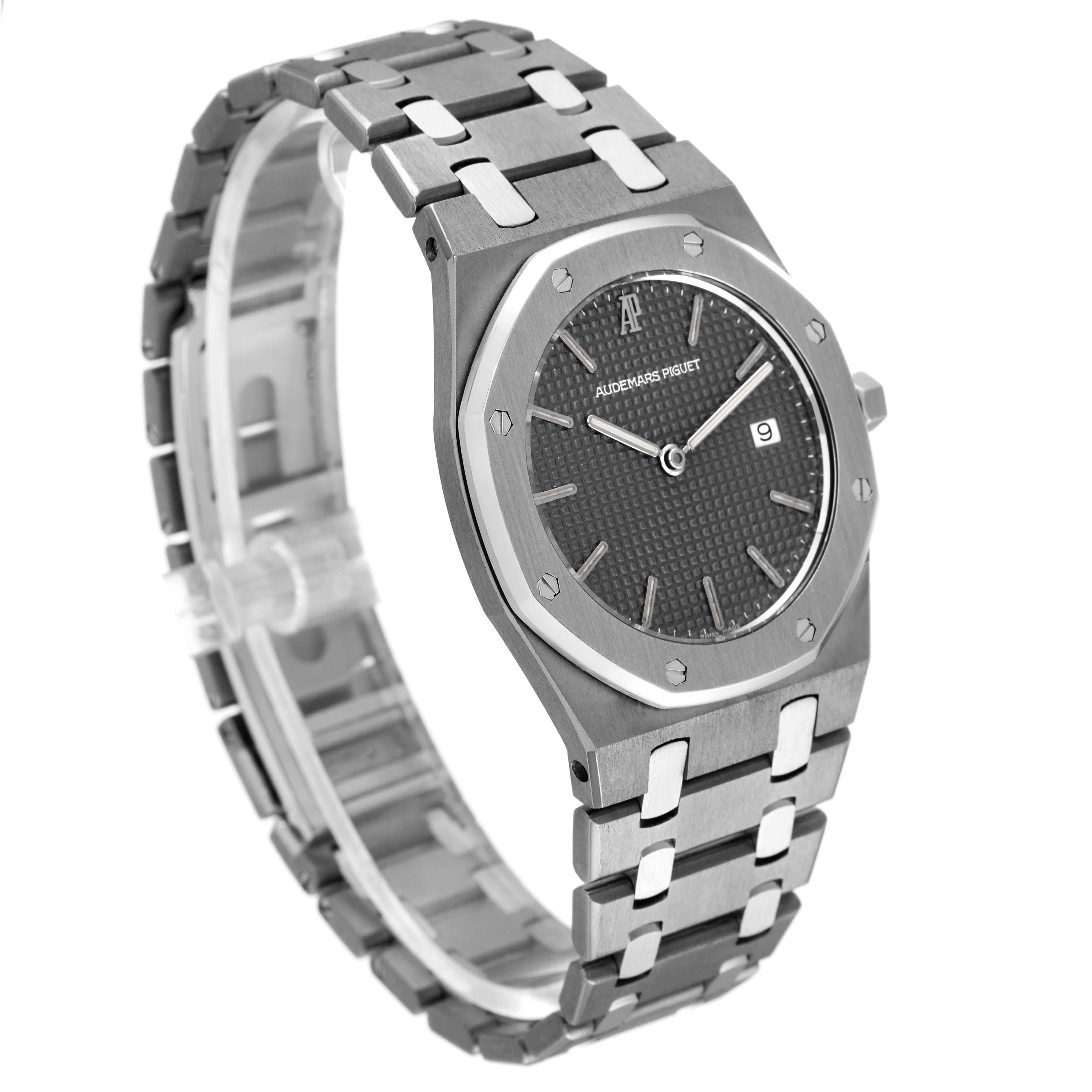 The image shows an angled view of the Audemars Piguet Royal Oak 56175TT Men's Titanium Grey Dial 56175TT Men's Titanium Grey Dial watch, featuring its case, dial, bracelet, and date window.