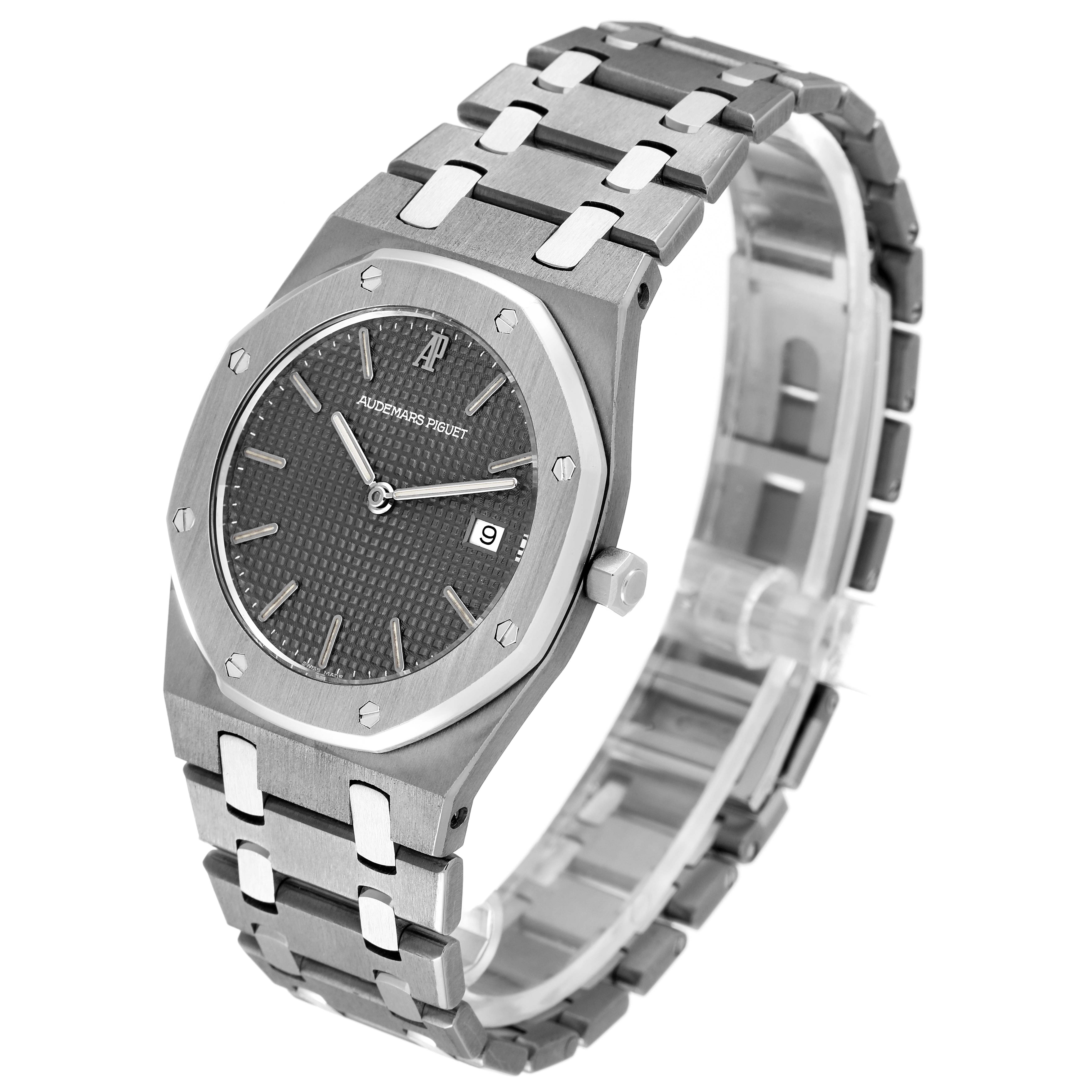 This image shows a side view of the Royal Oak watch by Audemars Piguet, highlighting its octagonal bezel, dial, and bracelet.