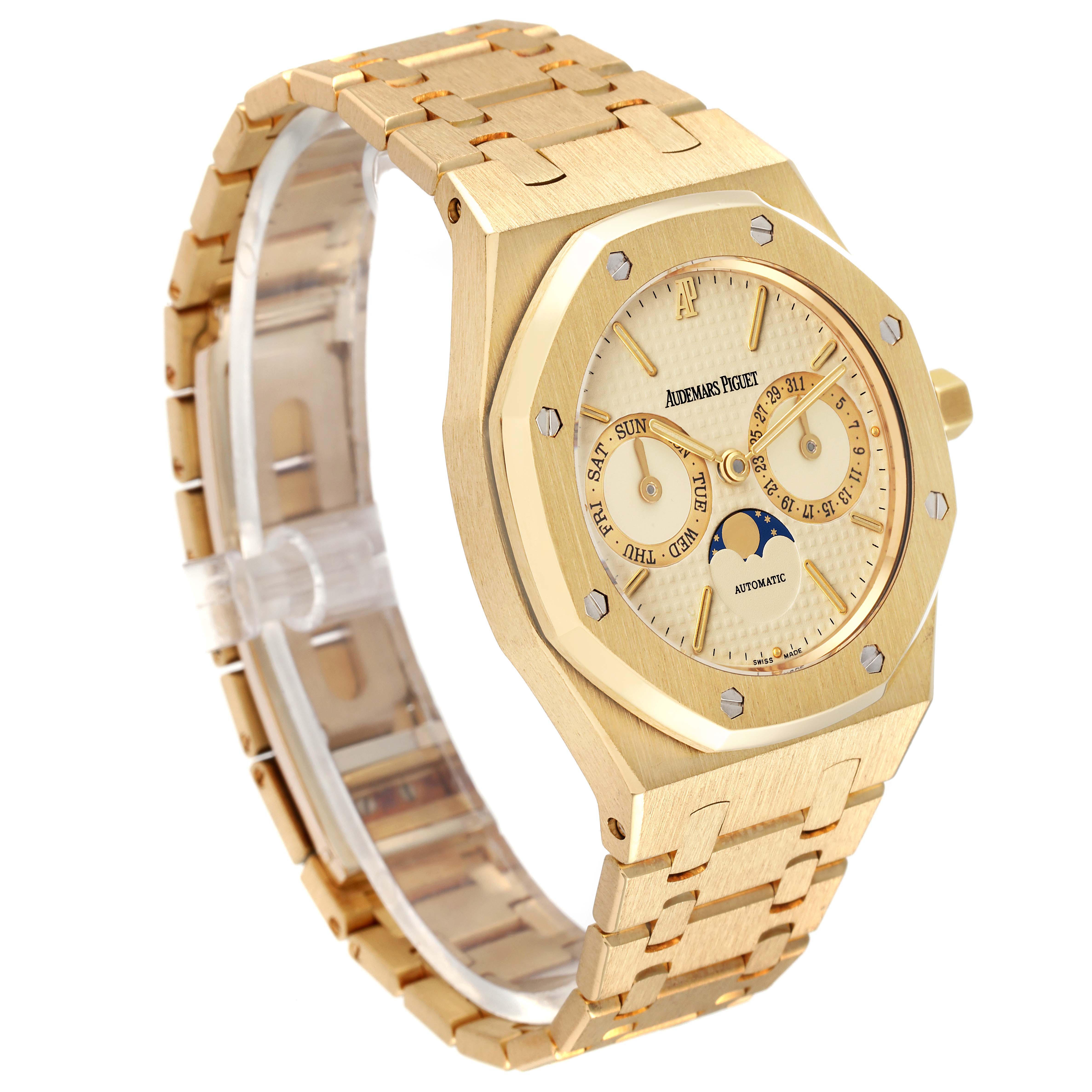 The image shows a gold Audemars Piguet Royal Oak 25594BA.OO.0477BA.01 Men's Yellow Gold Champagne Dial 25594BA.OO.0477BA.01 Men's Yellow Gold Champagne Dial watch at a three-quarter angle, displaying the watch face and bracelet.