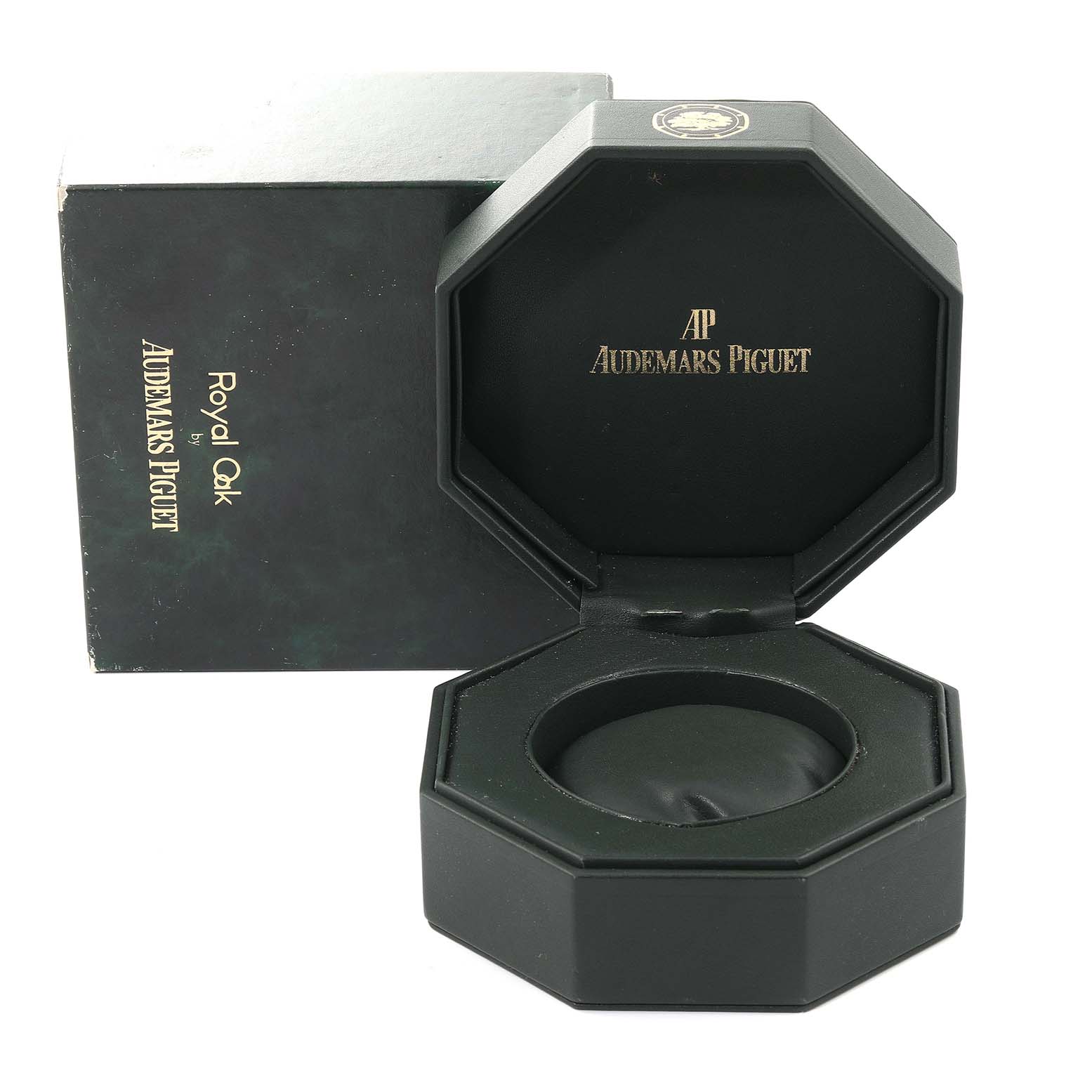 The image shows an open Royal Oak by Audemars Piguet watch box with a matching outer box behind it.