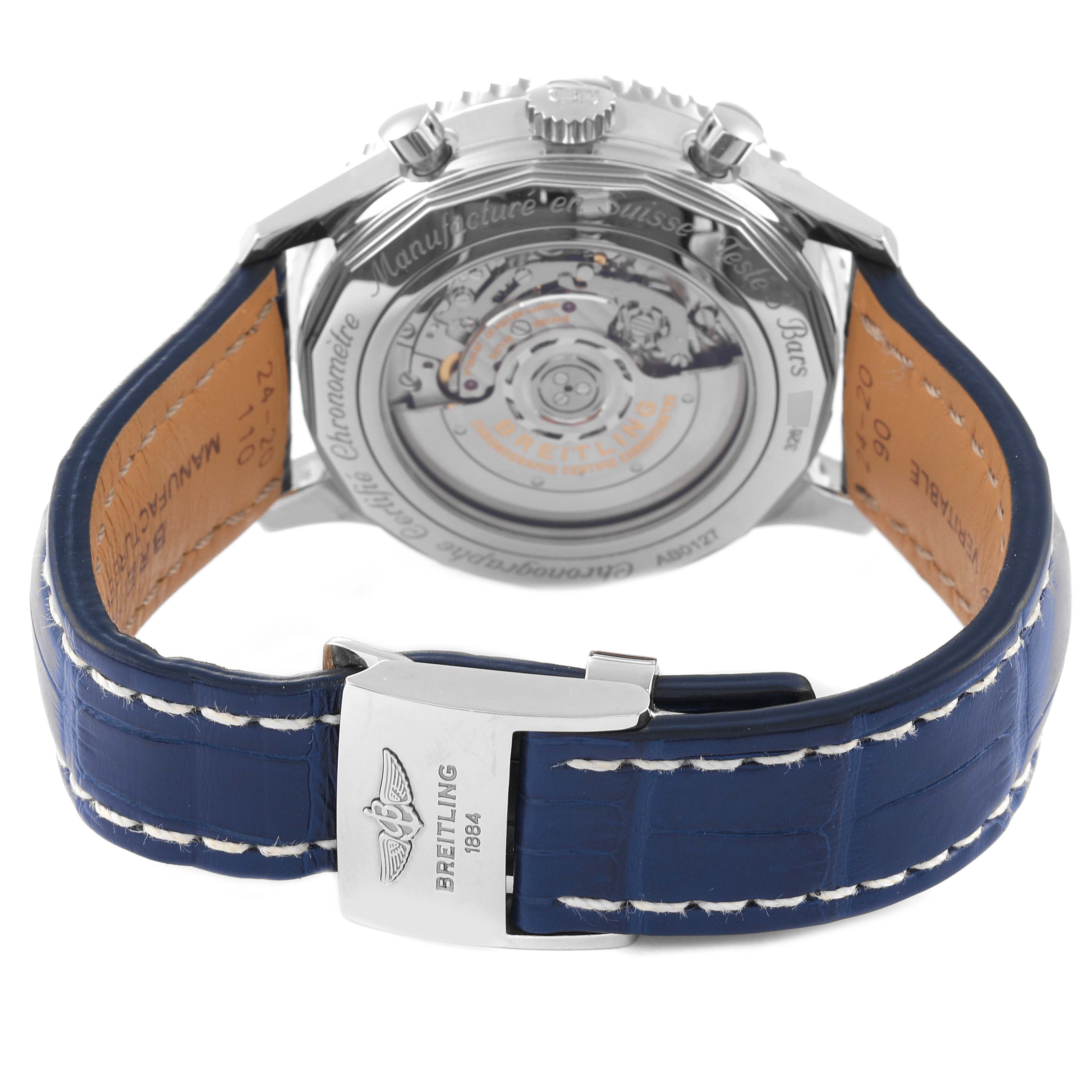This image shows the back view of a Breitling Navitimer AB0127 Men's Stainless Steel Blue Dial AB0127 Men's Stainless Steel Blue Dial watch, focusing on its movement and blue leather strap with a branded clasp.