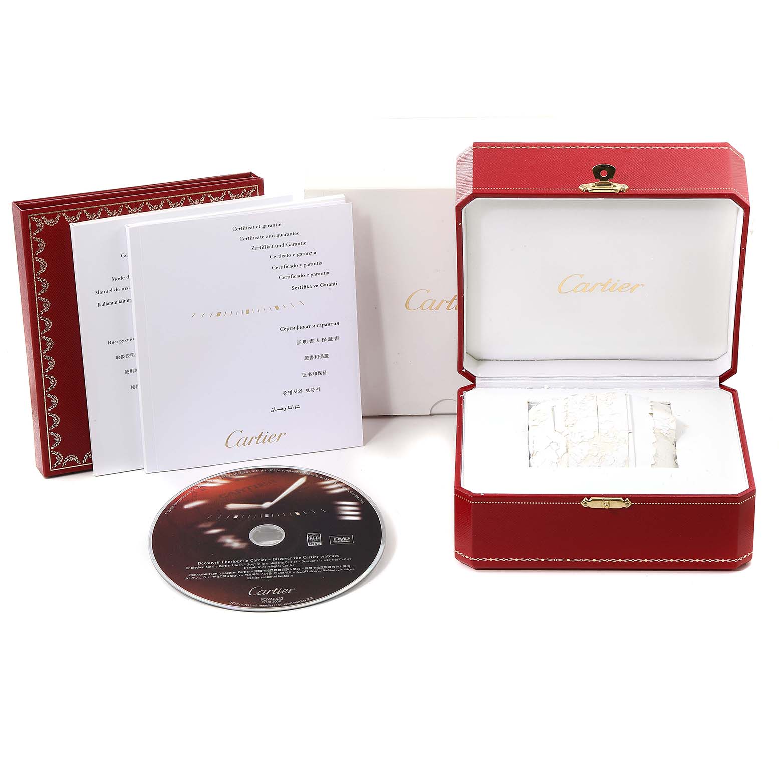 The image shows the box, certificate, booklet, and a CD of a Calibre de Cartier watch by Cartier.