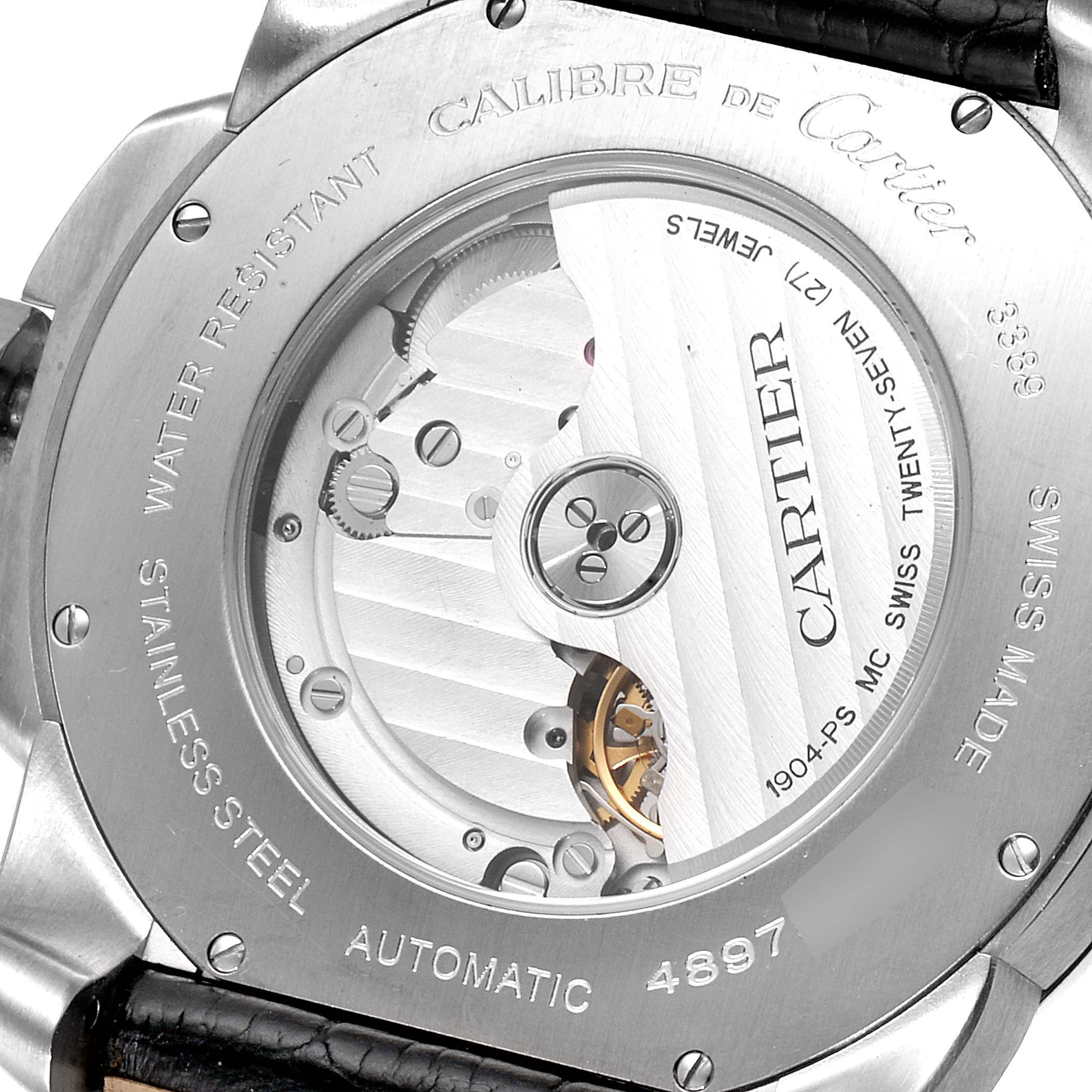 The image shows the back view of a Calibre de Cartier watch by Cartier, highlighting the automatic movement and inner mechanisms.