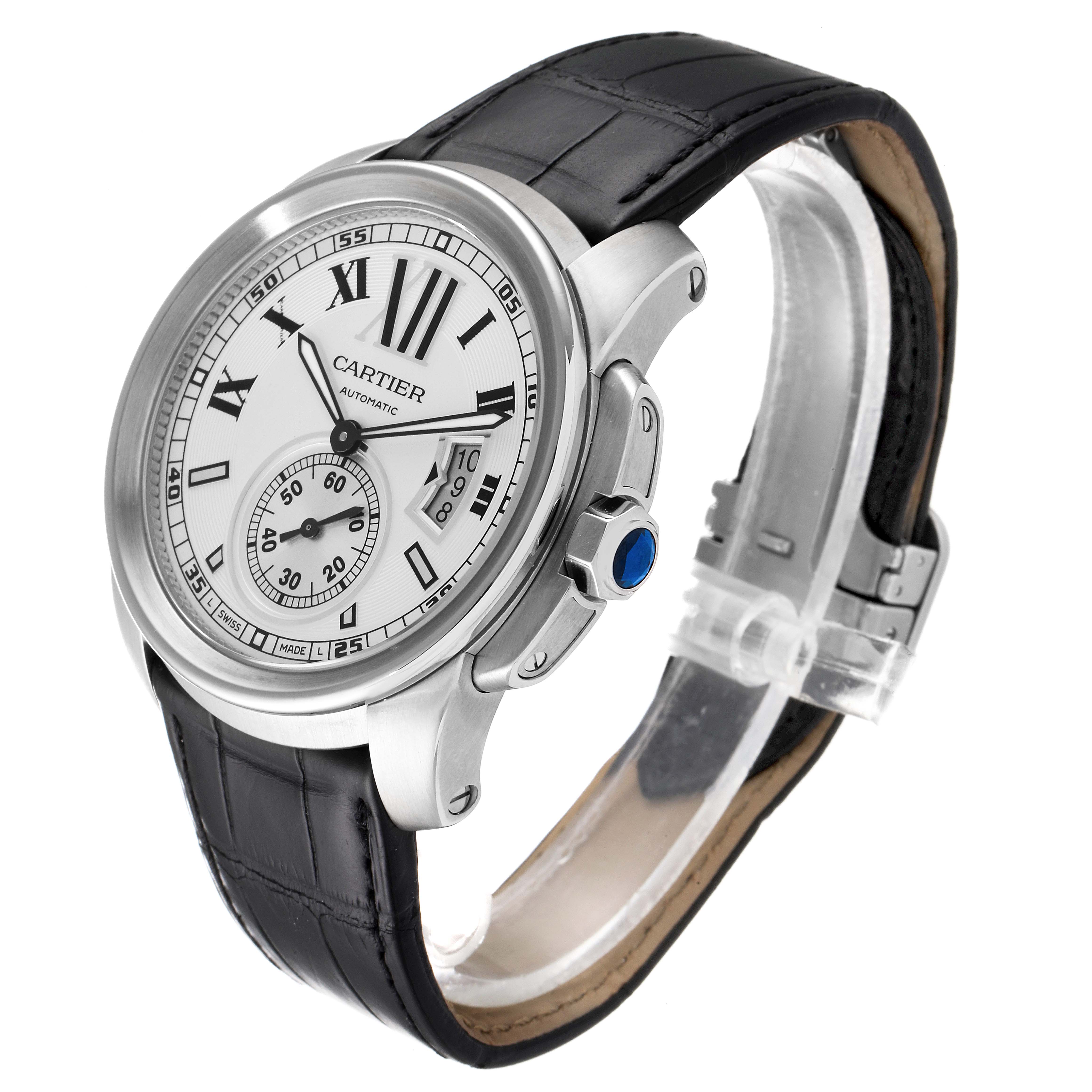 The Calibre de Cartier watch is shown at a three-quarter angle, highlighting its dial, case, crown, and leather strap.