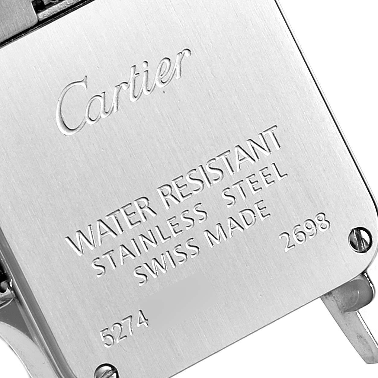 This image shows the back case of a Cartier Santos Demoiselle W25066Z6 Women's Steel and Gold (two tone) Silver Dial W25066Z6 Women's Steel and Gold (two tone) Silver Dial watch, highlighting its engravings and screw details.