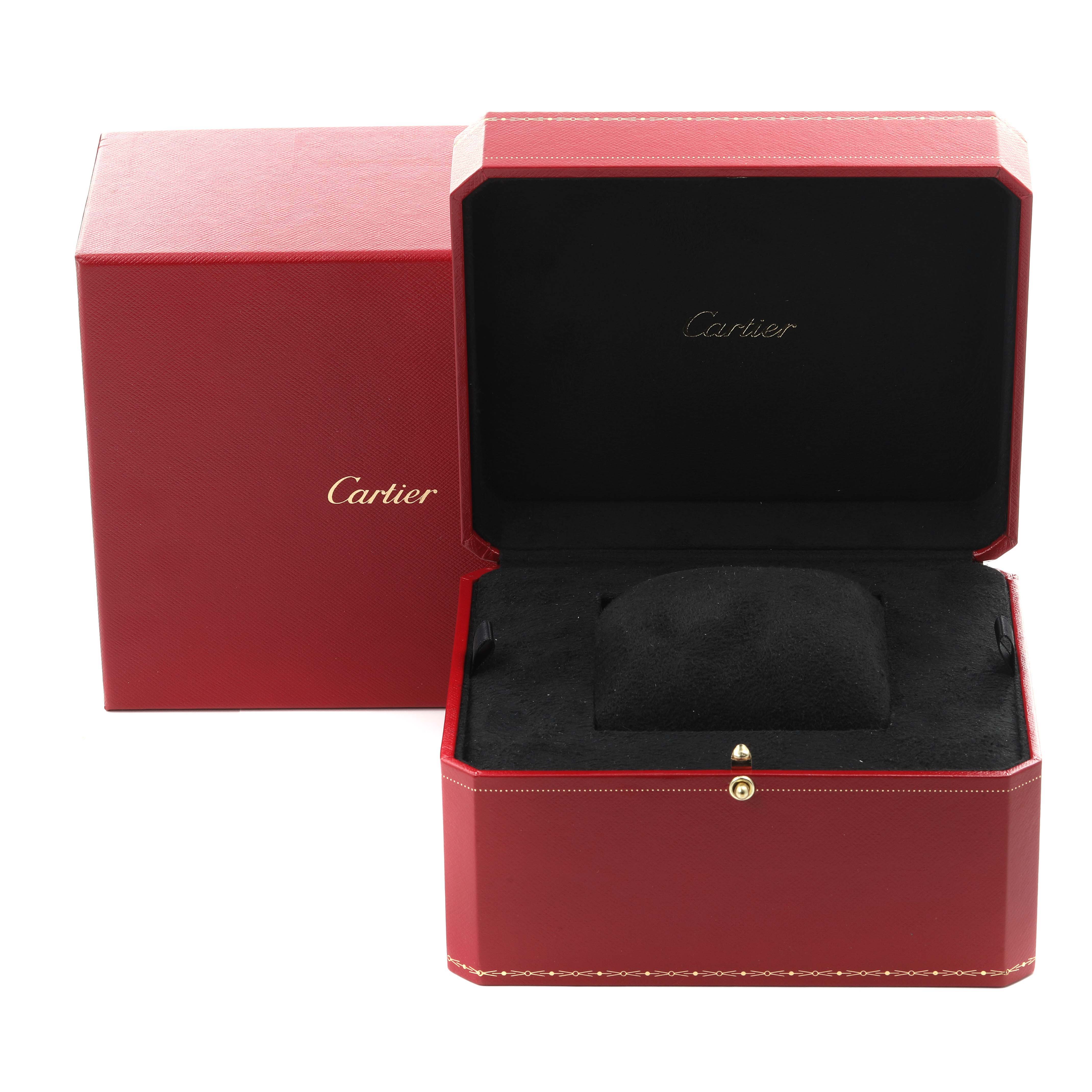 The image shows an open Cartier Santos W20011C4 Men's Steel and Gold (two tone) Silver Dial W20011C4 Men's Steel and Gold (two tone) Silver Dial watch box, highlighting the interior and exterior design.