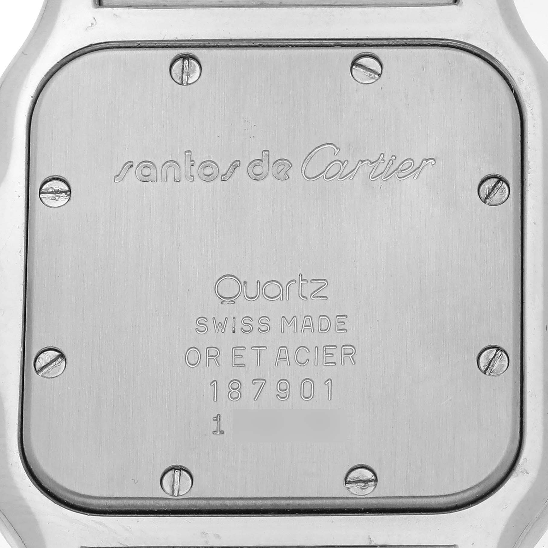 The image shows the case back of a Cartier Santos W20011C4 Men's Steel and Gold (two tone) Silver Dial W20011C4 Men's Steel and Gold (two tone) Silver Dial watch, displaying engravings and screws.