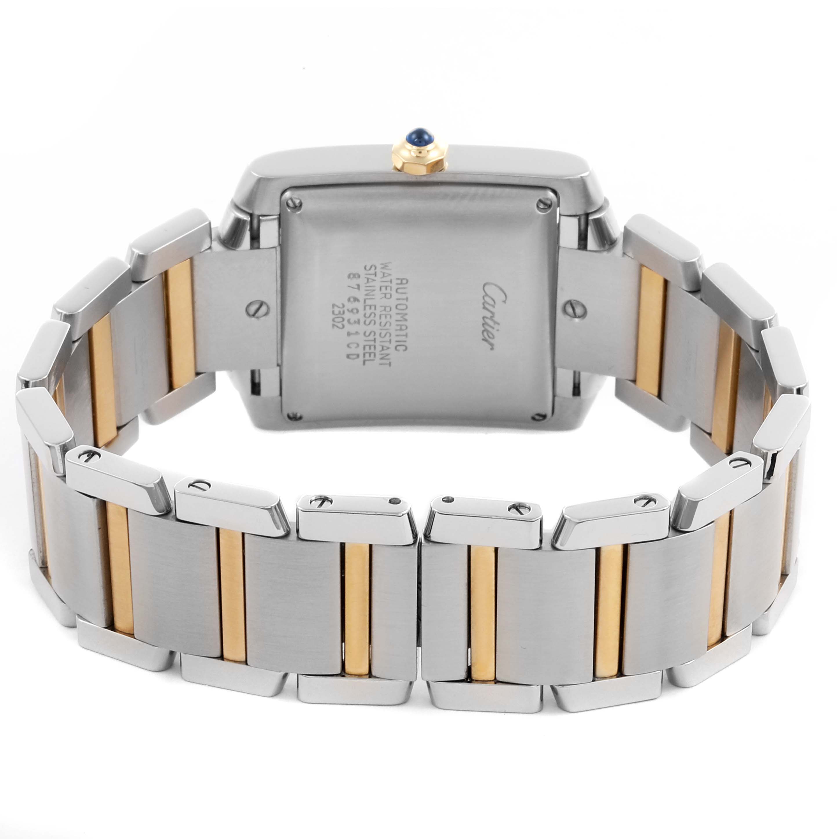The image shows the back view of a Cartier Tank Française watch, highlighting its stainless steel and gold bracelet.