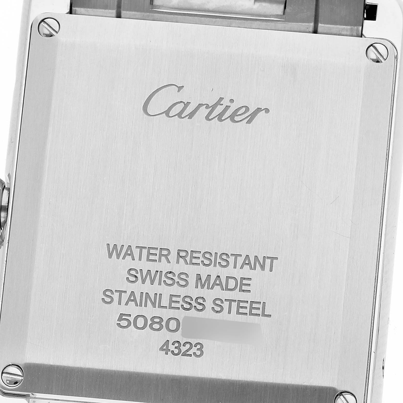 This image shows the back plate of the Cartier Tank Must WSTA0052 Women's Stainless Steel Silver Dial WSTA0052 Women's Stainless Steel Silver Dial watch, highlighting details like water resistance and stainless steel composition.