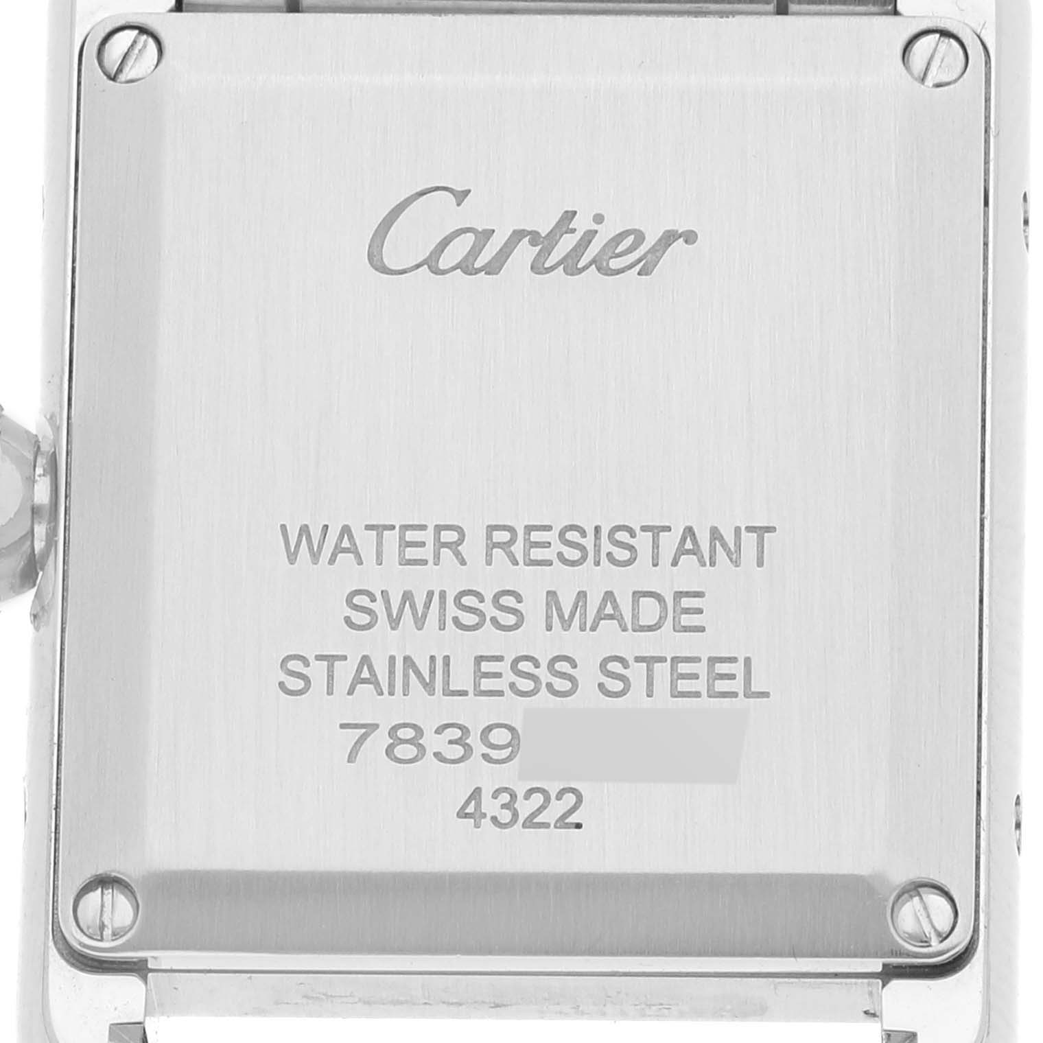 This image shows the back cover of a Cartier Tank Solo WSTA0051 Women's Stainless Steel Silver Dial WSTA0051 Women's Stainless Steel Silver Dial watch, highlighting details such as water resistance, material, and serial numbers.