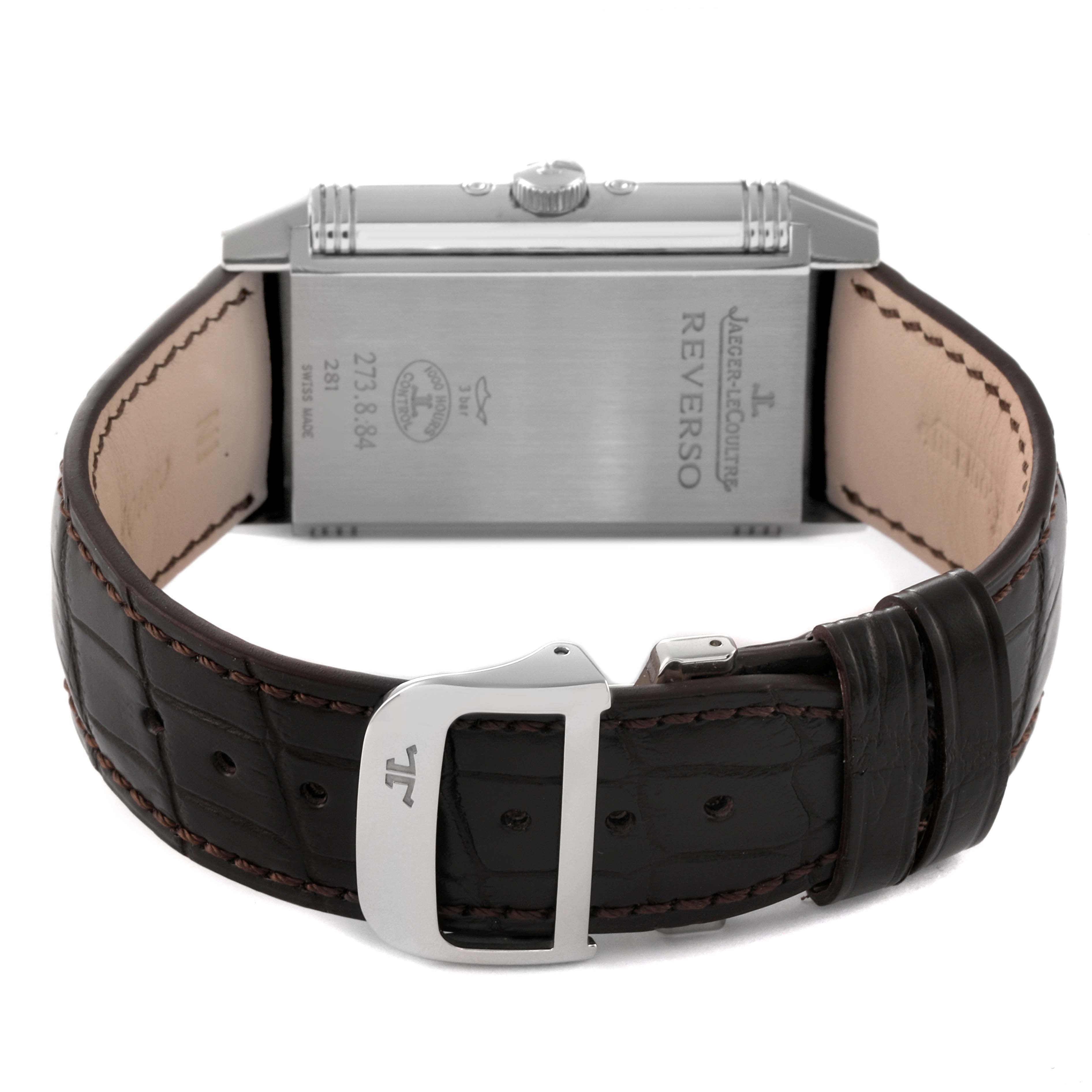 The image shows the back case and strap of a Jaeger-LeCoultre Reverso watch from a rear angle.