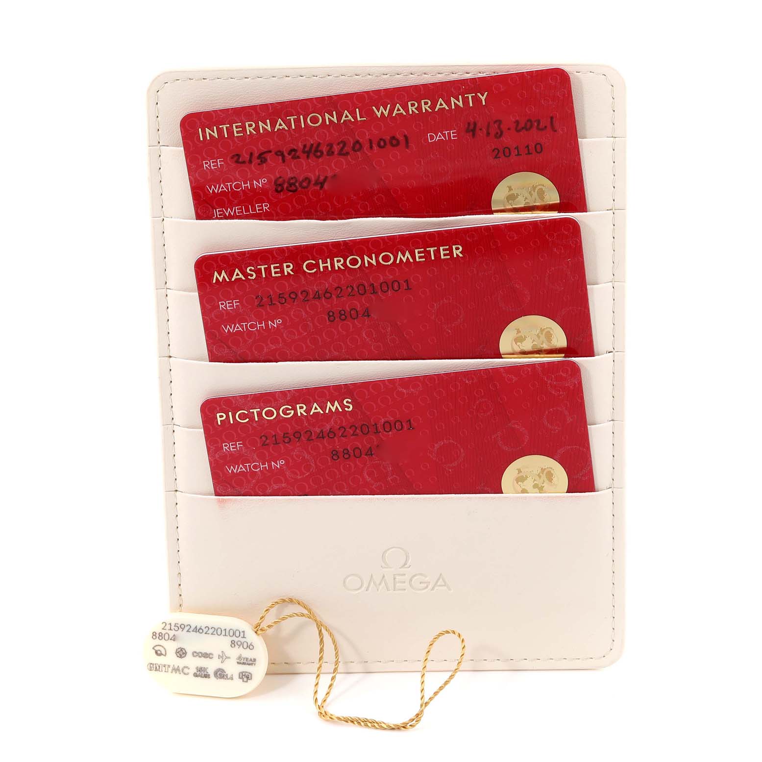 The image shows the warranty, master chronometer, and pictograms cards for the Omega Planet Ocean 215.92.46.22.01.001 Men's Ceramic Black Dial 215.92.46.22.01.001 Men's Ceramic Black Dial model, along with a tag.