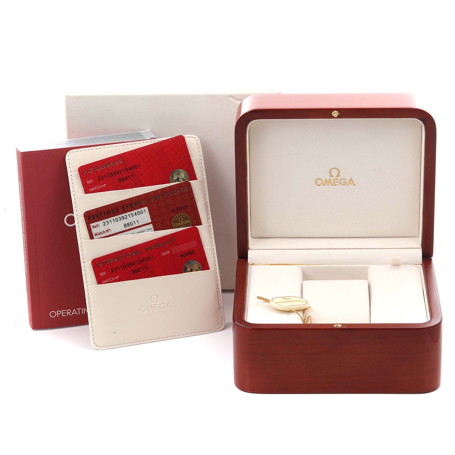 The image shows the Omega Seamaster's box, warranty cards, and operating instructions at a front angle.