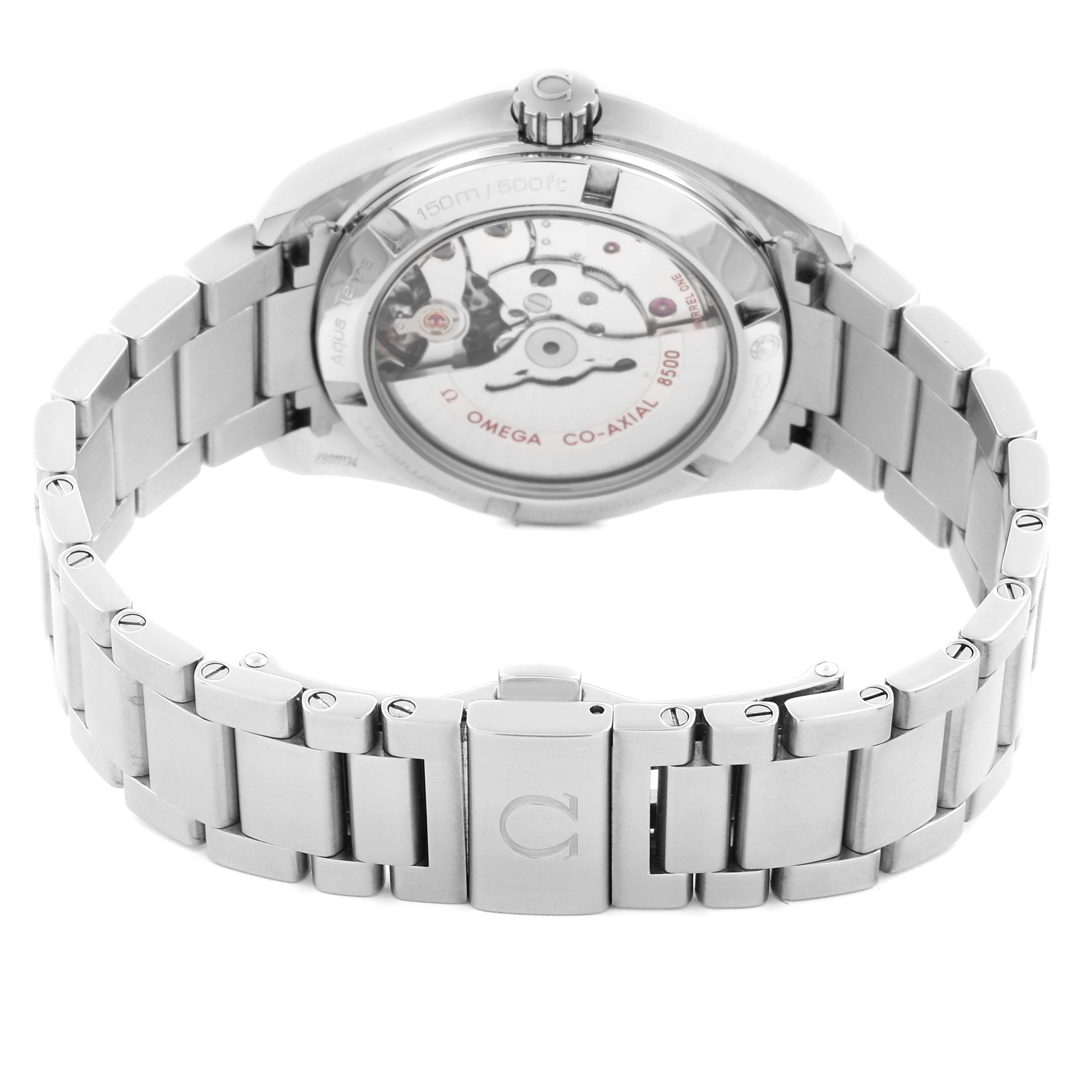 The Omega Seamaster watch is shown from the back, highlighting its movement and bracelet clasp.