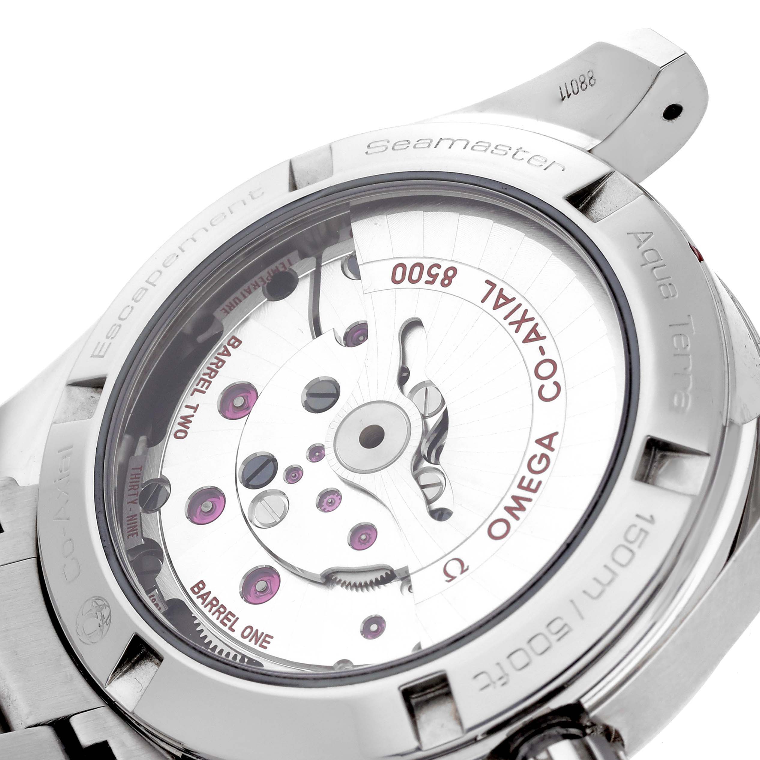 The Omega Seamaster is shown from the back, highlighting the Co-Axial 8500 movement with visible barrels and jewels.