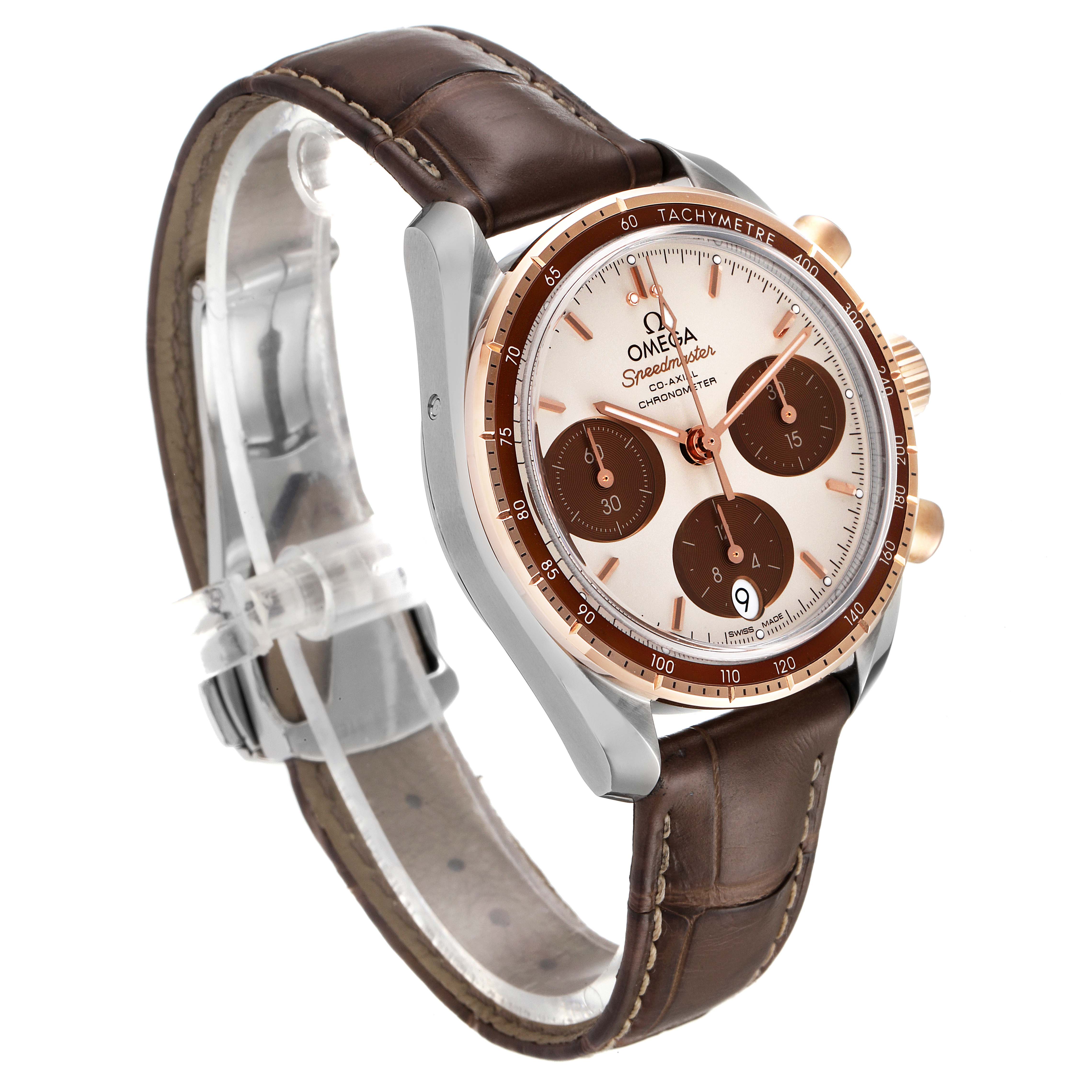 The image shows a side angle of the Omega Speedmaster 324.23.38.50.02.002 Men's Steel and Gold (two tone) Silver Dial 324.23.38.50.02.002 Men's Steel and Gold (two tone) Silver Dial watch, displaying its dial, chronograph sub-dials, tachymeter bezel, and leather strap.