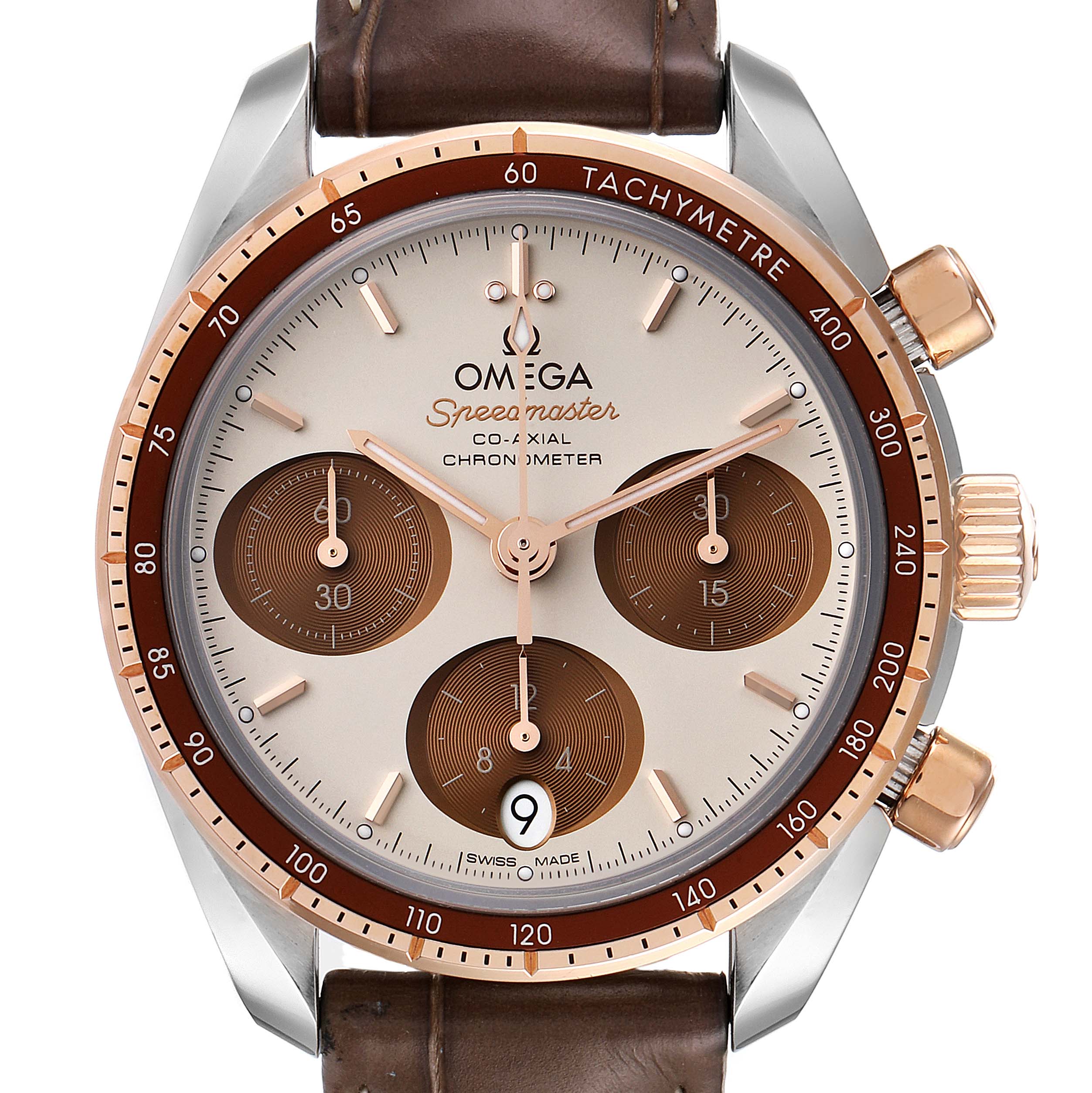 This image shows a frontal view of the Omega Speedmaster 324.23.38.50.02.002 Men's Steel and Gold (two tone) Silver Dial 324.23.38.50.02.002 Men's Steel and Gold (two tone) Silver Dial watch, highlighting its dial, leather strap, subdials, and tachymetre bezel.