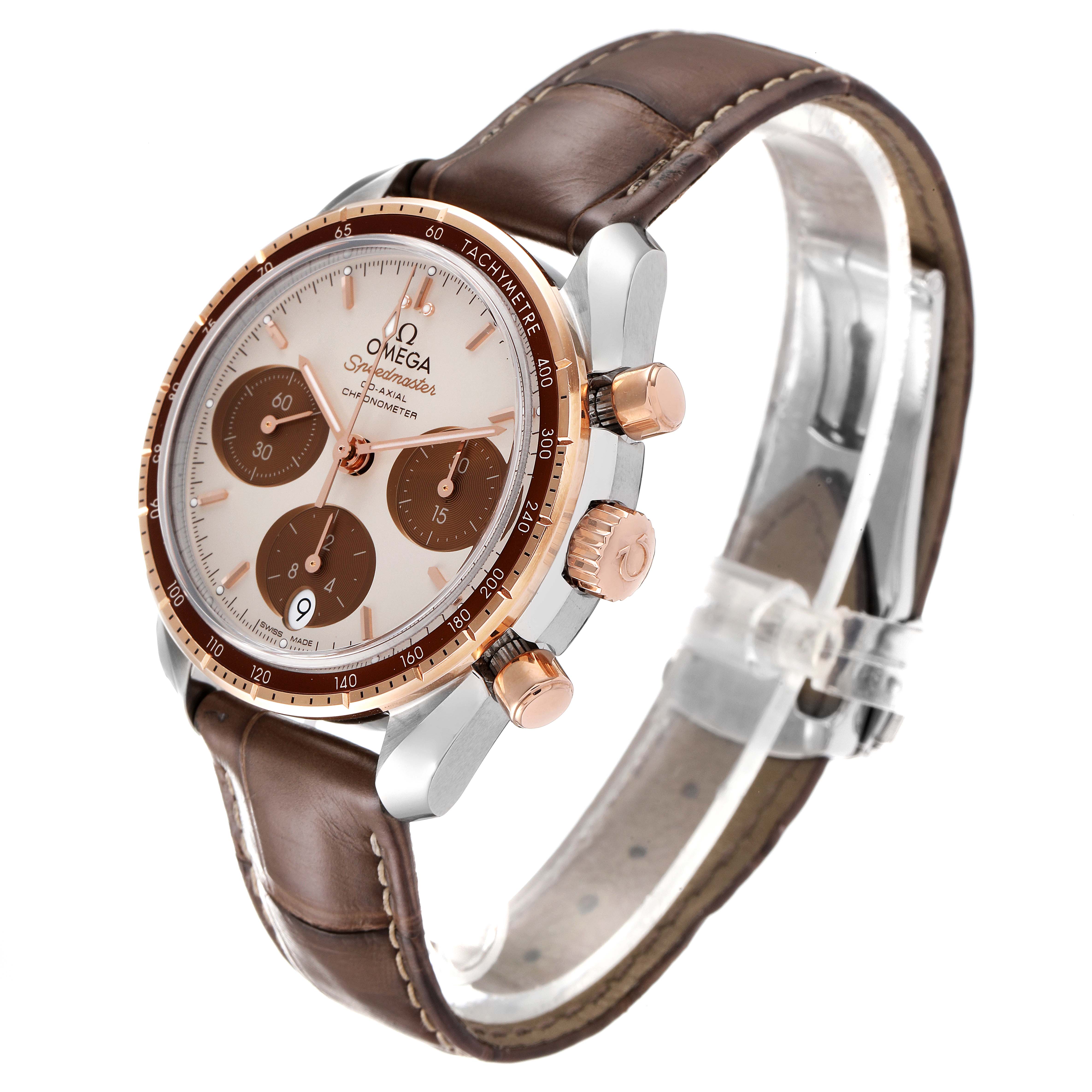 The Omega Speedmaster 324.23.38.50.02.002 Men's Steel and Gold (two tone) Silver Dial 324.23.38.50.02.002 Men's Steel and Gold (two tone) Silver Dial watch is shown at a side angle, highlighting its face, sub-dials, bezel, crown, push-buttons, and leather strap.