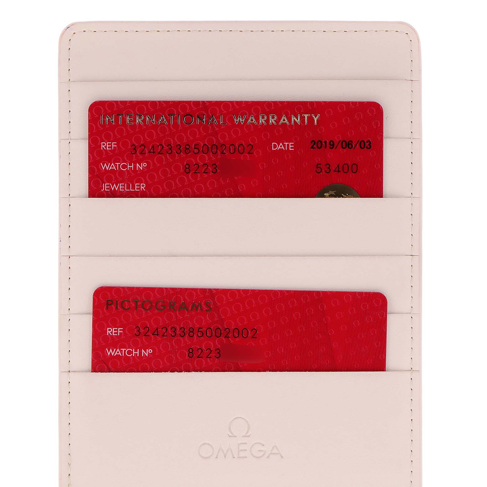 The image shows the international warranty and pictograms cards for an Omega Speedmaster 324.23.38.50.02.002 Men's Steel and Gold (two tone) Silver Dial 324.23.38.50.02.002 Men's Steel and Gold (two tone) Silver Dial watch in a cardholder.
