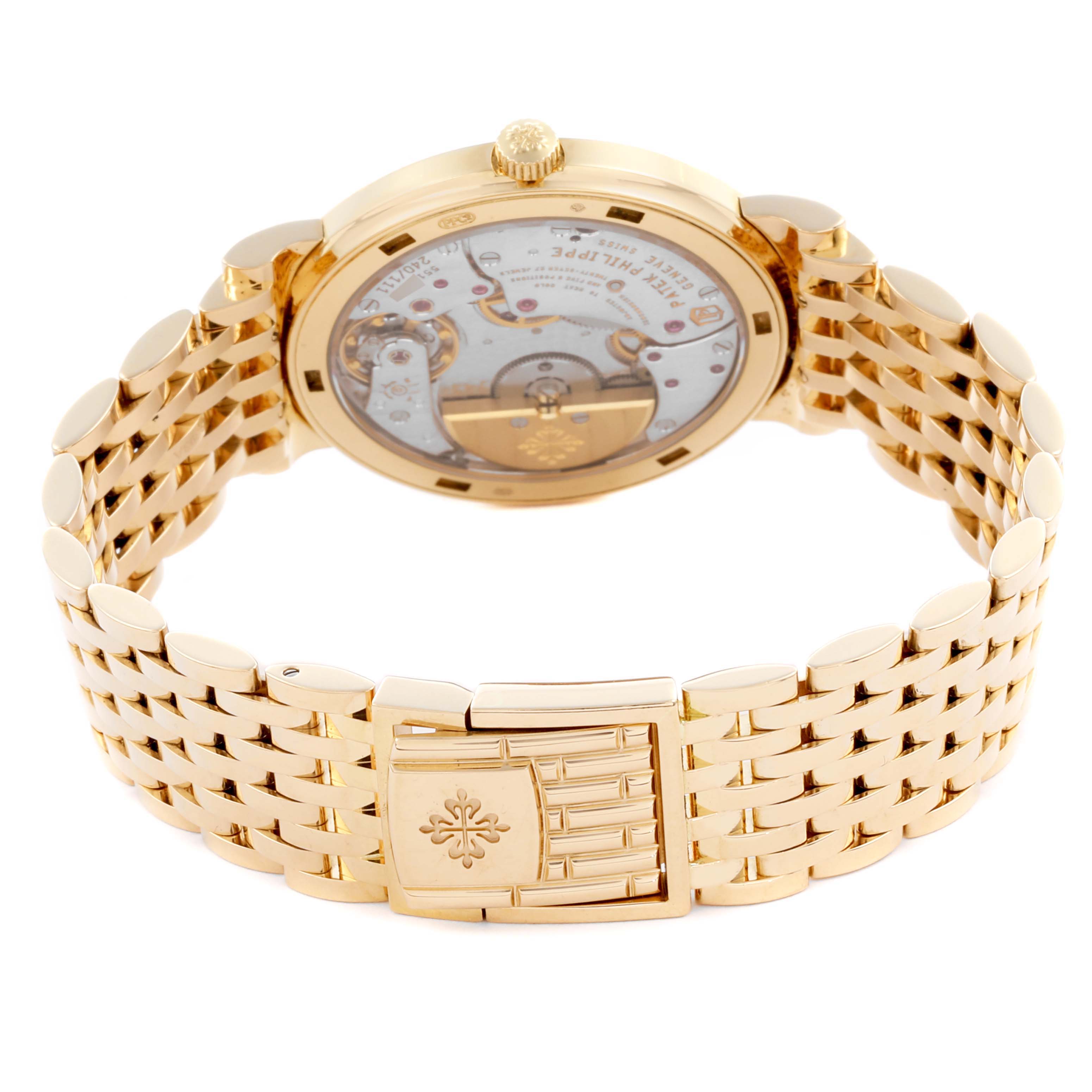 The image shows the back and bracelet of a Patek Philippe Calatrava 5120/1J Men's Yellow Gold Silver Dial 5120/1J Men's Yellow Gold Silver Dial watch, highlighting its clasp and movement.