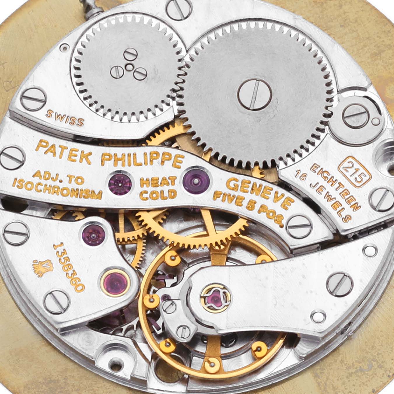 The image shows the intricate inner mechanism of a Patek Philippe Calatrava 3919G-001 Men
s White Gold White Dial 3919G-001 Men
s White Gold White Dial watch, revealing its gears and jewels.