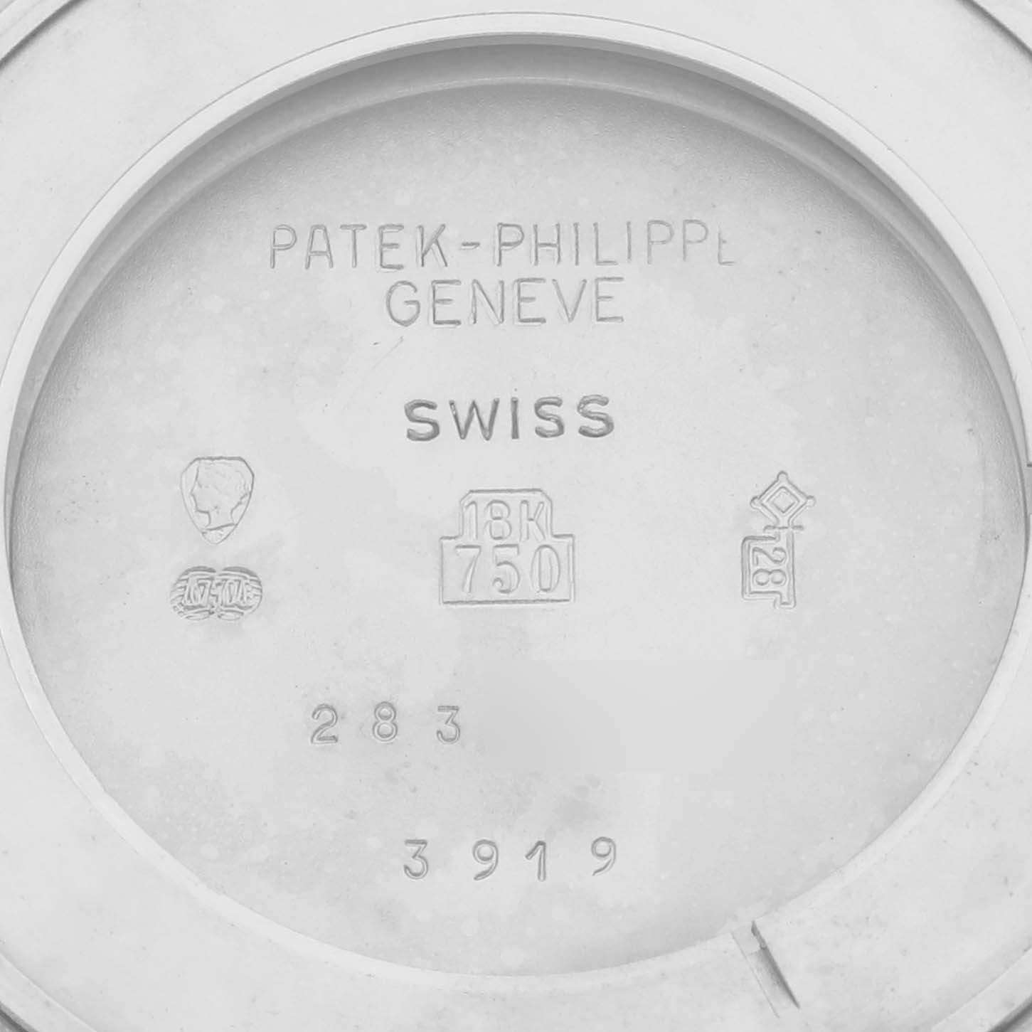 The image shows the inner case back of a Patek Philippe Calatrava 3919G-001 Men
s White Gold White Dial 3919G-001 Men
s White Gold White Dial, featuring engravings and hallmarks.