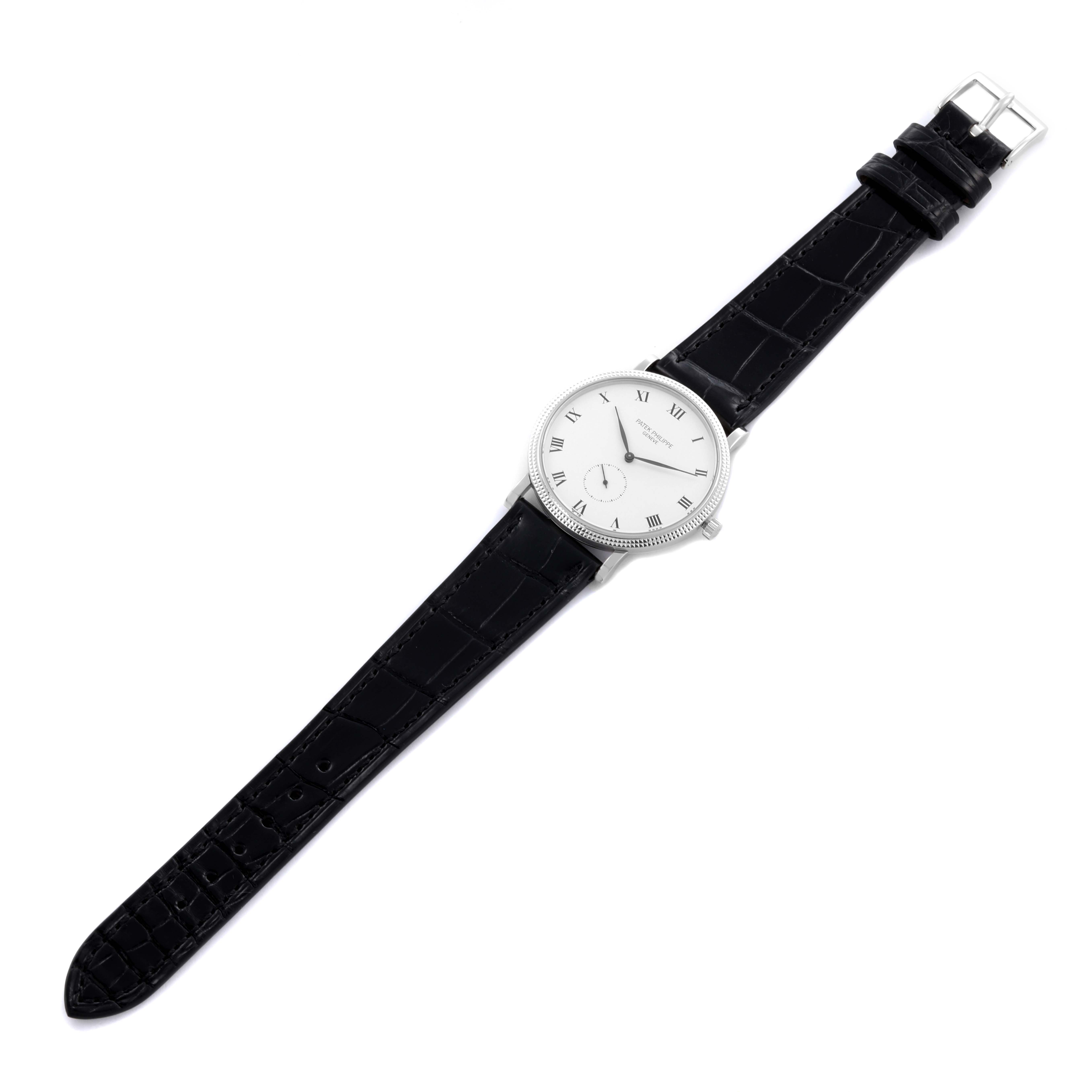The Patek Philippe Calatrava 3919G-001 Men
s White Gold White Dial 3919G-001 Men
s White Gold White Dial watch is shown from a top-down angle, displaying the entire face and leather strap.