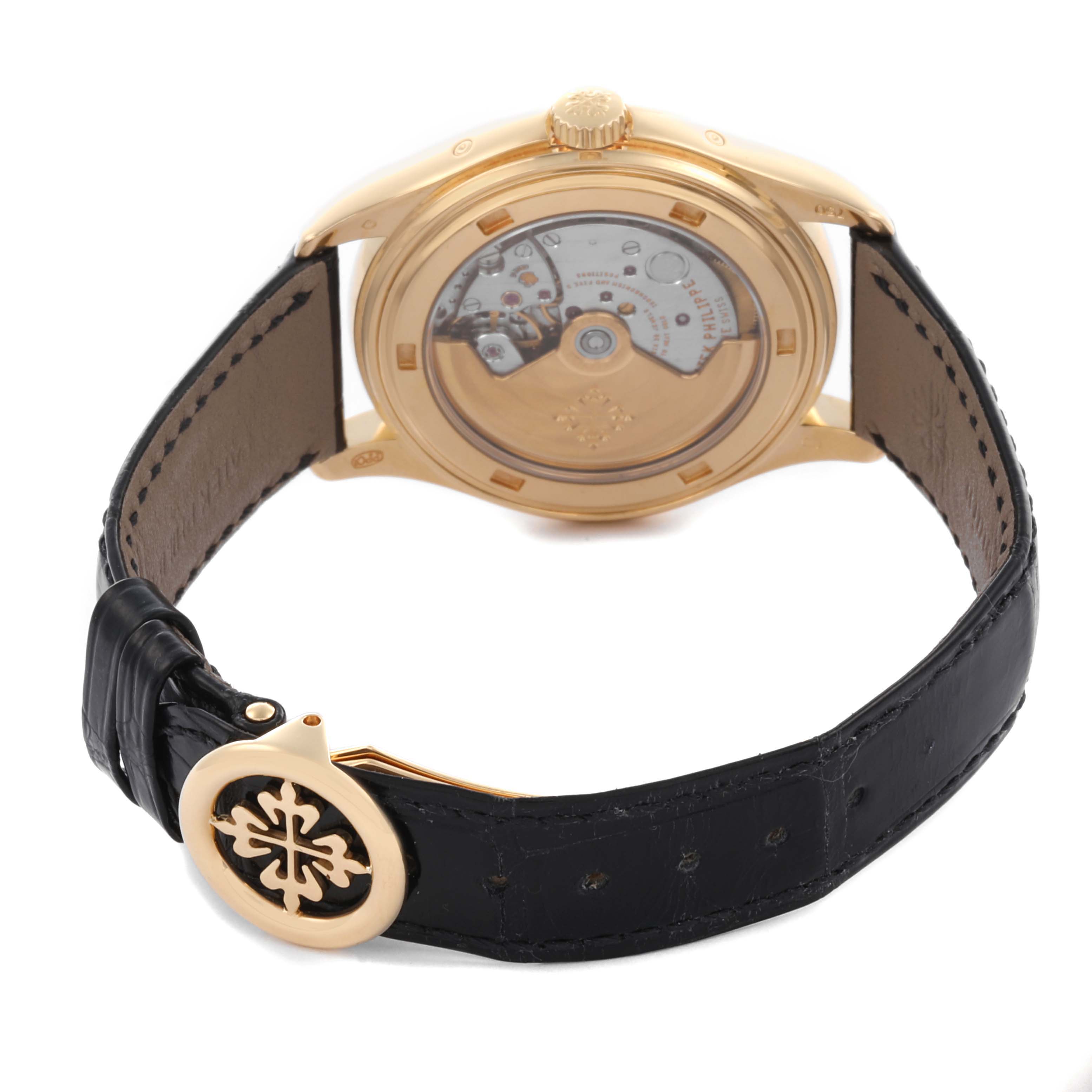 The image shows the back view of a Patek Philippe Complications 5146J-010 Men's Yellow Gold Grey Dial 5146J-010 Men's Yellow Gold Grey Dial watch, highlighting the case back and leather strap with the clasp.