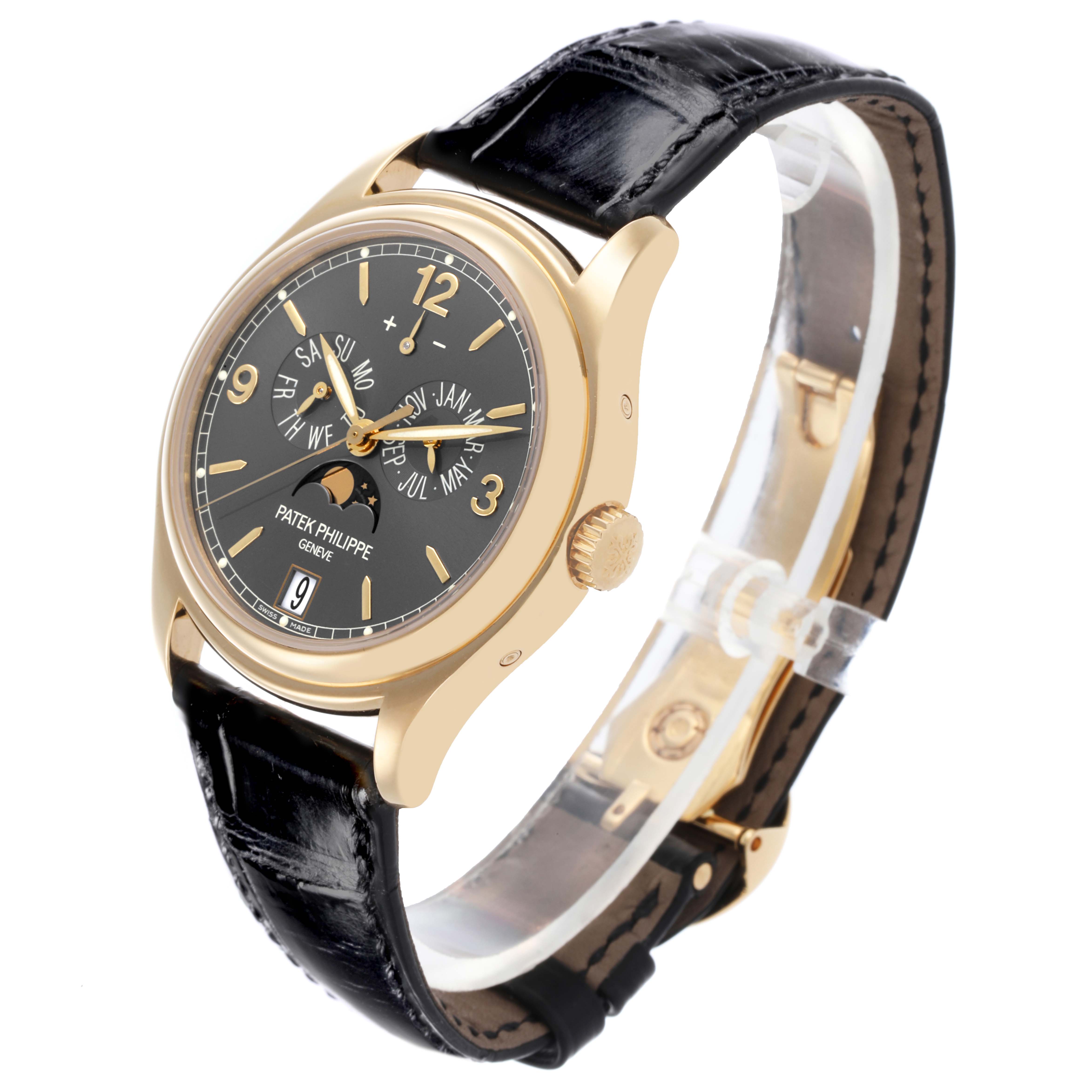 The Patek Philippe Complications 5146J-010 Men's Yellow Gold Grey Dial 5146J-010 Men's Yellow Gold Grey Dial watch is shown at a slight angle, displaying its face, crown, and leather strap.