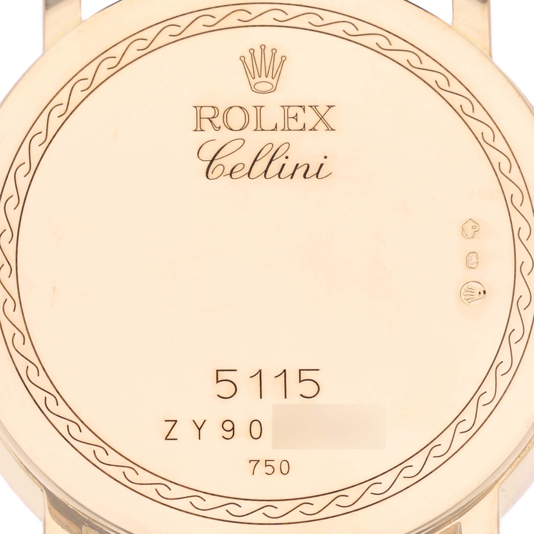 The image shows the back of a Rolex Cellini 5115 Men's Yellow Gold White Dial 5115 Men's Yellow Gold White Dial watch, highlighting engravings and the model name.