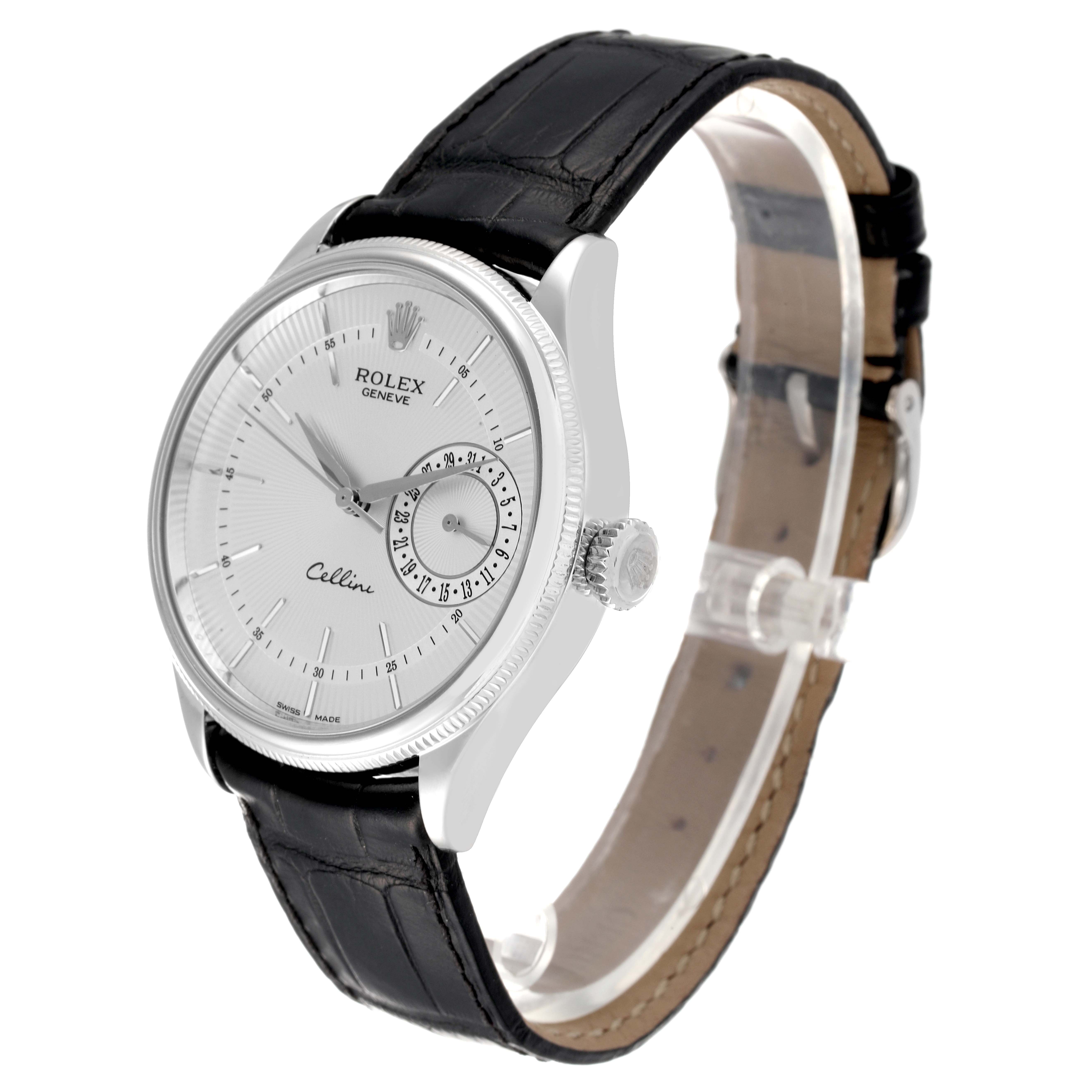 The image shows a Rolex Cellini 50519 Men
s White Gold Silver Dial 50519 Men
s White Gold Silver Dial watch from a three-quarter angle, displaying its dial, crown, and black leather strap.