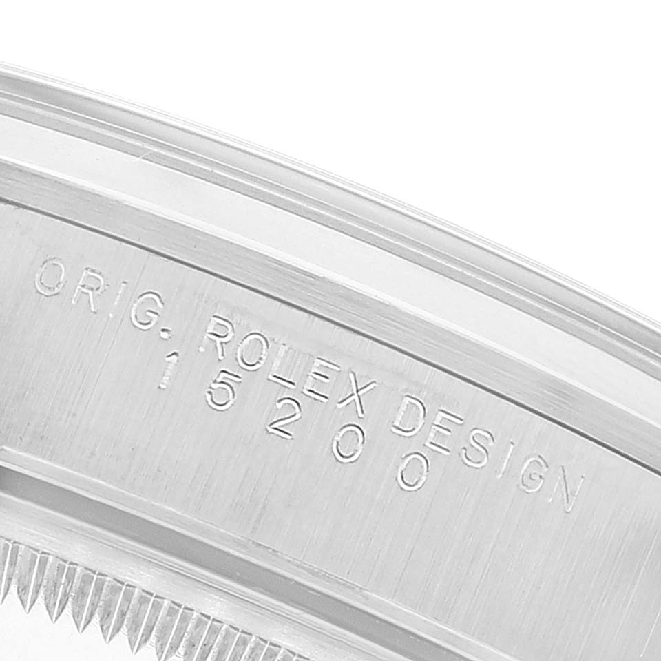 Close-up of the side casing of a Rolex Date 15200 Men
s Stainless Steel Black Dial 15200 Men
s Stainless Steel Black Dial model, showing the "ORIG. ROLEX DESIGN" engraving and model number 15200.