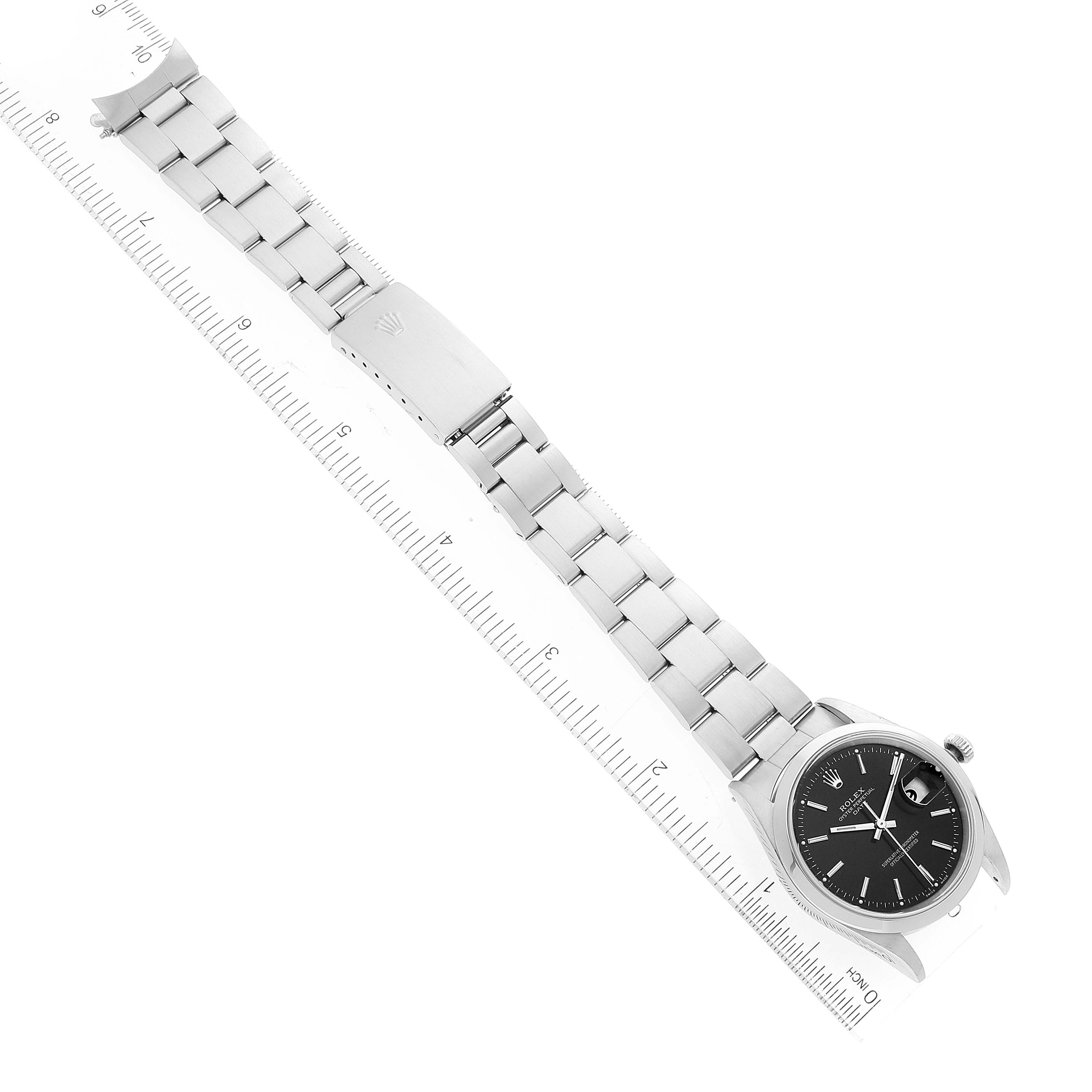 This image shows a top-down view of a Rolex Date 15200 Men
s Stainless Steel Black Dial 15200 Men
s Stainless Steel Black Dial model watch with the face, bracelet, and clasp visible along a ruler.