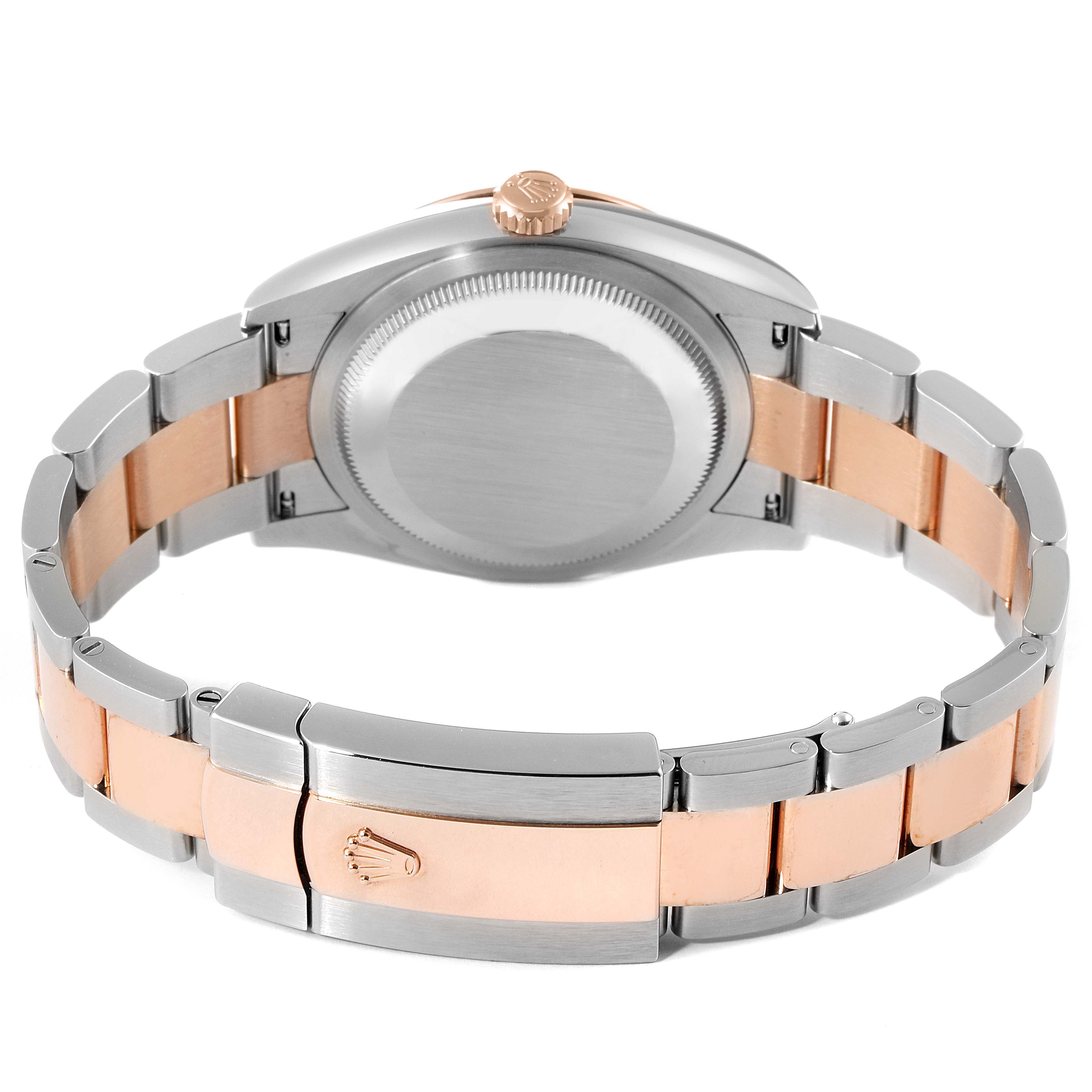 The image shows the back of a Rolex Datejust 126201 Men
s Steel and Gold (two tone) Grey Dial 126201 Men
s Steel and Gold (two tone) Grey Dial watch, highlighting its two-tone bracelet and clasp.