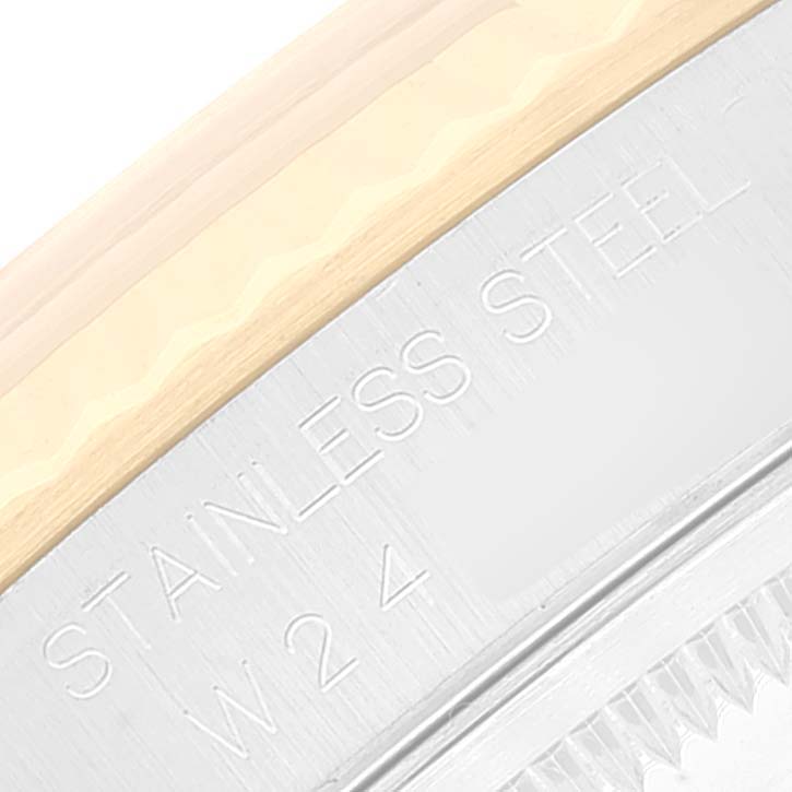 This image shows a close-up of the side and bezel of a Rolex Datejust 16233 Men's Steel and Gold (two tone) Champagne Dial 16233 Men's Steel and Gold (two tone) Champagne Dial watch, highlighting "Stainless Steel" engraving.