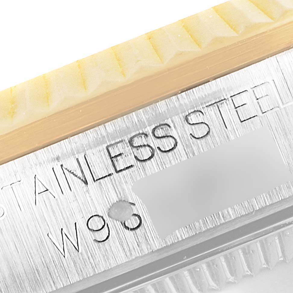 This close-up angle shows the side engraving of a stainless steel Rolex Mid-Size 68273 Women's Steel and Gold (two tone) Champagne Dial 68273 Women's Steel and Gold (two tone) Champagne Dial model watch case.