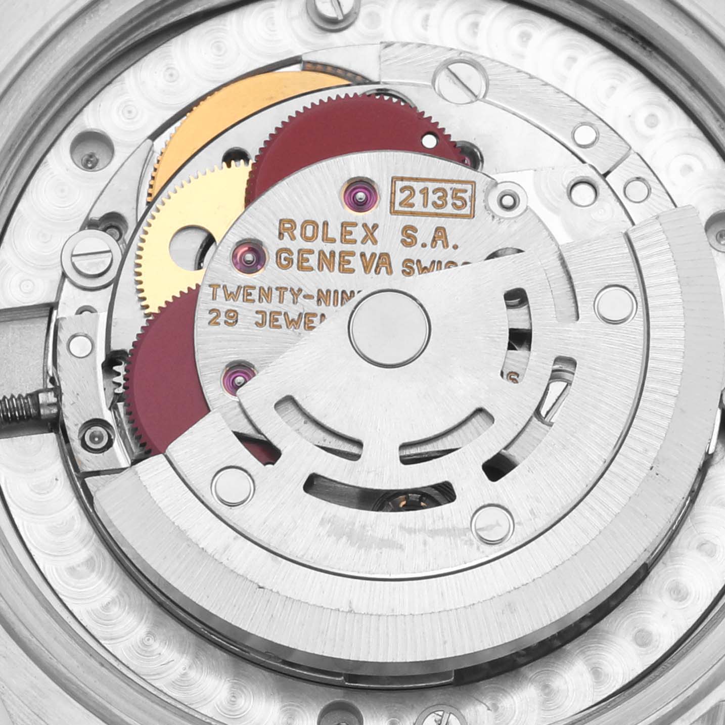 The image shows a close-up of the Rolex Mid-Size 68273 Women's Steel and Gold (two tone) White Dial 68273 Women's Steel and Gold (two tone) White Dial model's movement, displaying gears, jewels, and the rotor.