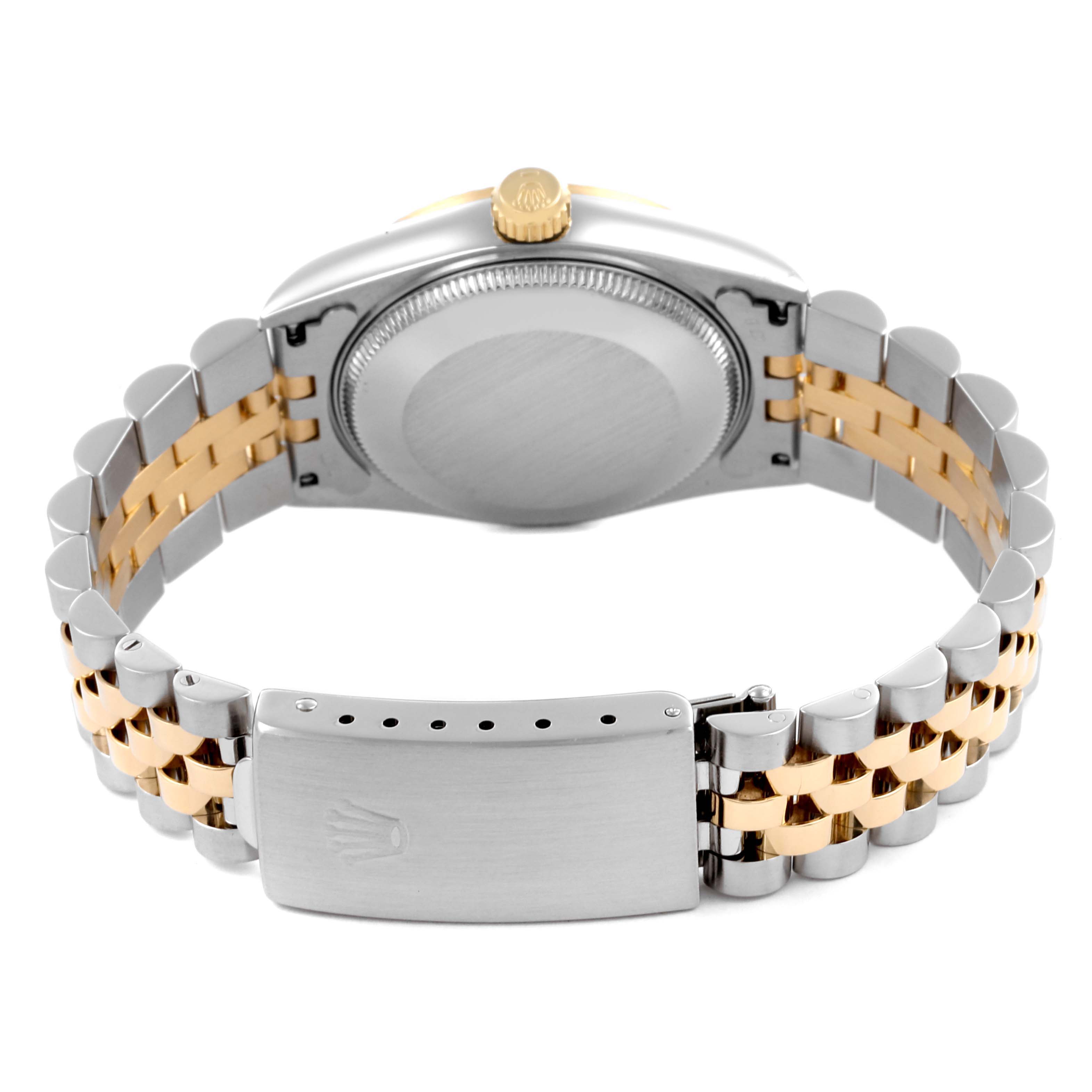 The Rolex Mid-Size 68273 Women's Steel and Gold (two tone) White Dial 68273 Women's Steel and Gold (two tone) White Dial model is shown from the back, focusing on the case back and two-tone bracelet with clasp.