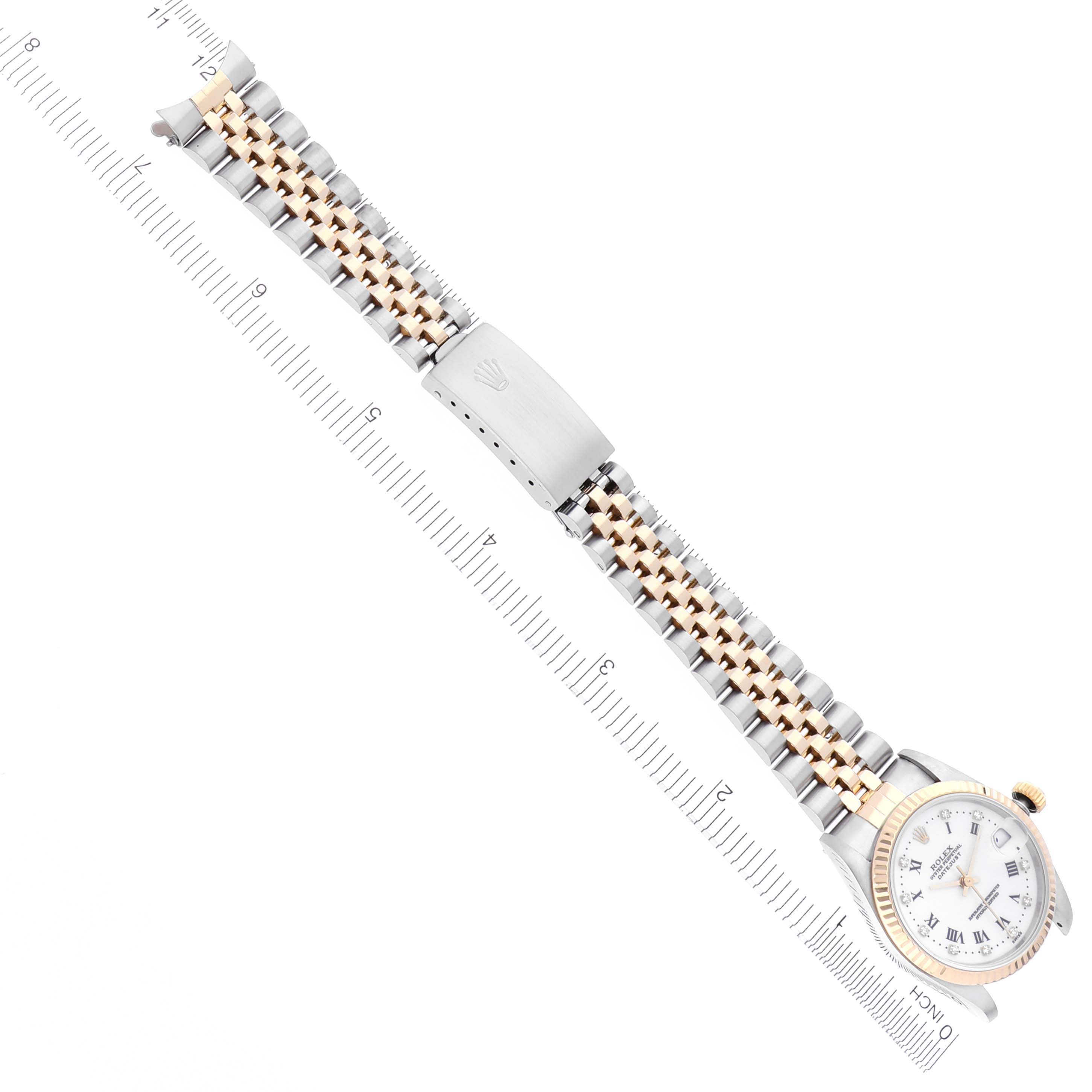 The image shows a Rolex Mid-Size 68273 Women's Steel and Gold (two tone) White Dial 68273 Women's Steel and Gold (two tone) White Dial watch from an overhead angle, highlighting the bracelet and watch face.