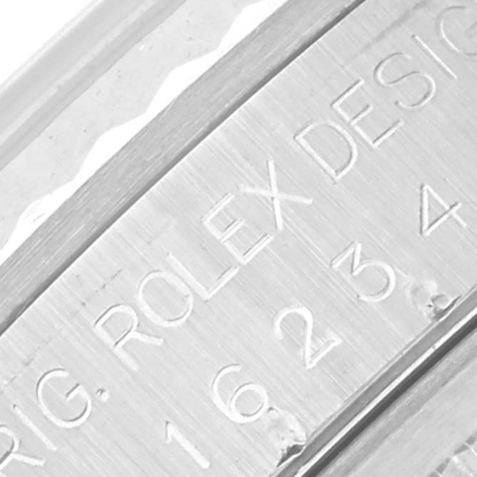 The image shows a close-up of the engraved side of a Rolex Datejust 16234G Men
s Stainless Steel Mother of Pearl Dial 16234G Men
s Stainless Steel Mother of Pearl Dial, highlighting the model number and brand name.