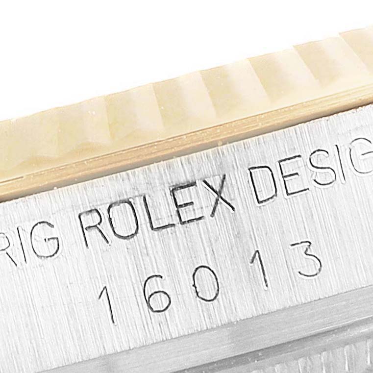 The image shows a close-up of the side of a Rolex Vintage Collection 16013 Men's Steel and Gold (two tone) White Dial 16013 Men's Steel and Gold (two tone) White Dial model, highlighting the engraved model number and design text.