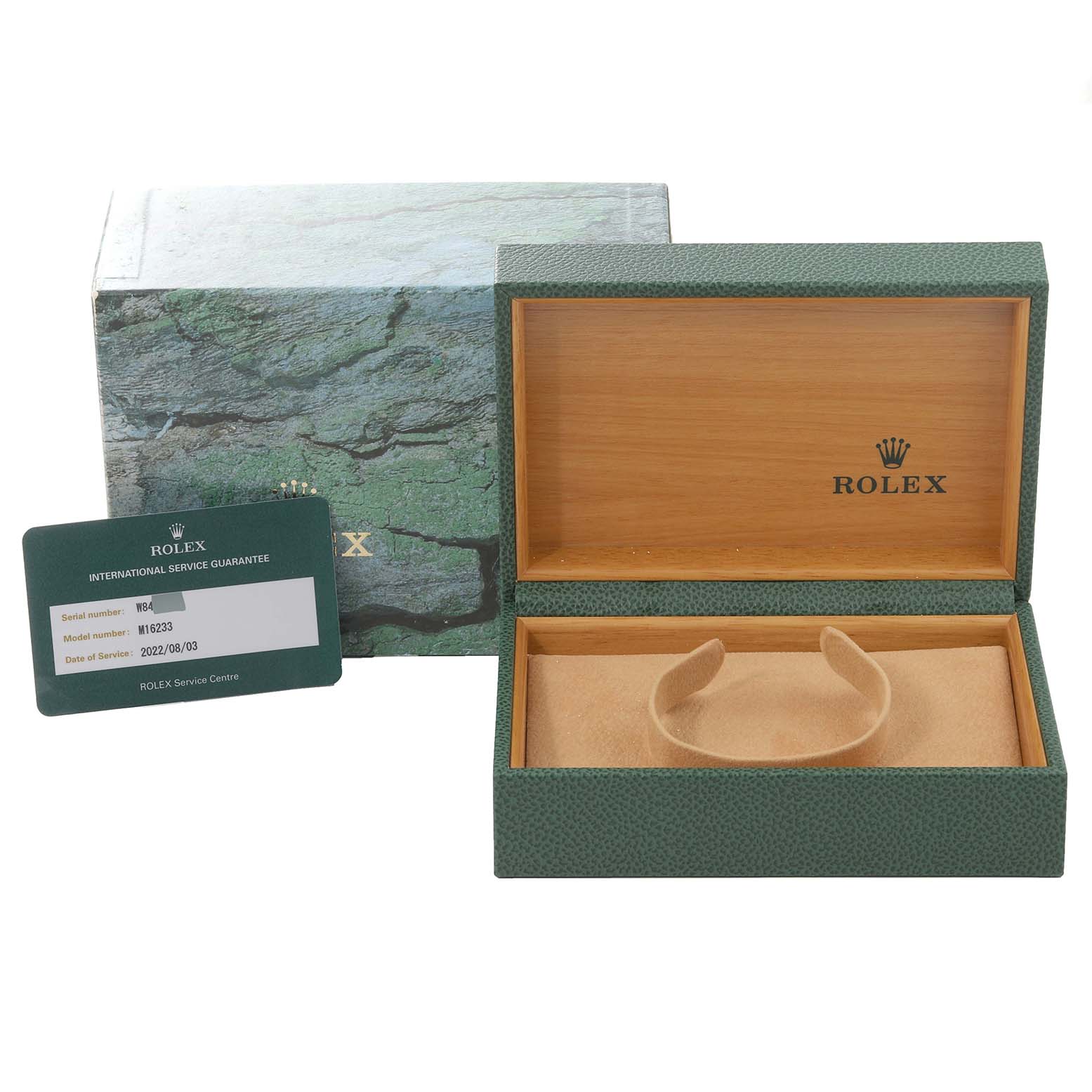 The image shows an open green Rolex box for the Datejust model, along with its outer box and an International Service Guarantee card.