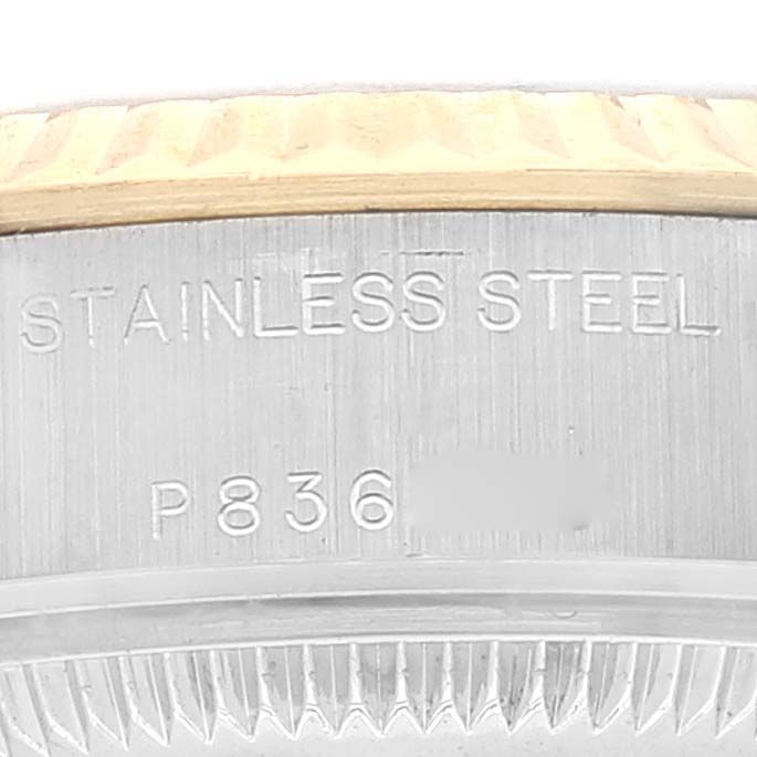 This image shows a close-up of the stainless steel caseback and bezel edge of a Rolex Datejust 79173 Women's Steel and Gold (two tone) Champagne Dial 79173 Women's Steel and Gold (two tone) Champagne Dial watch.
